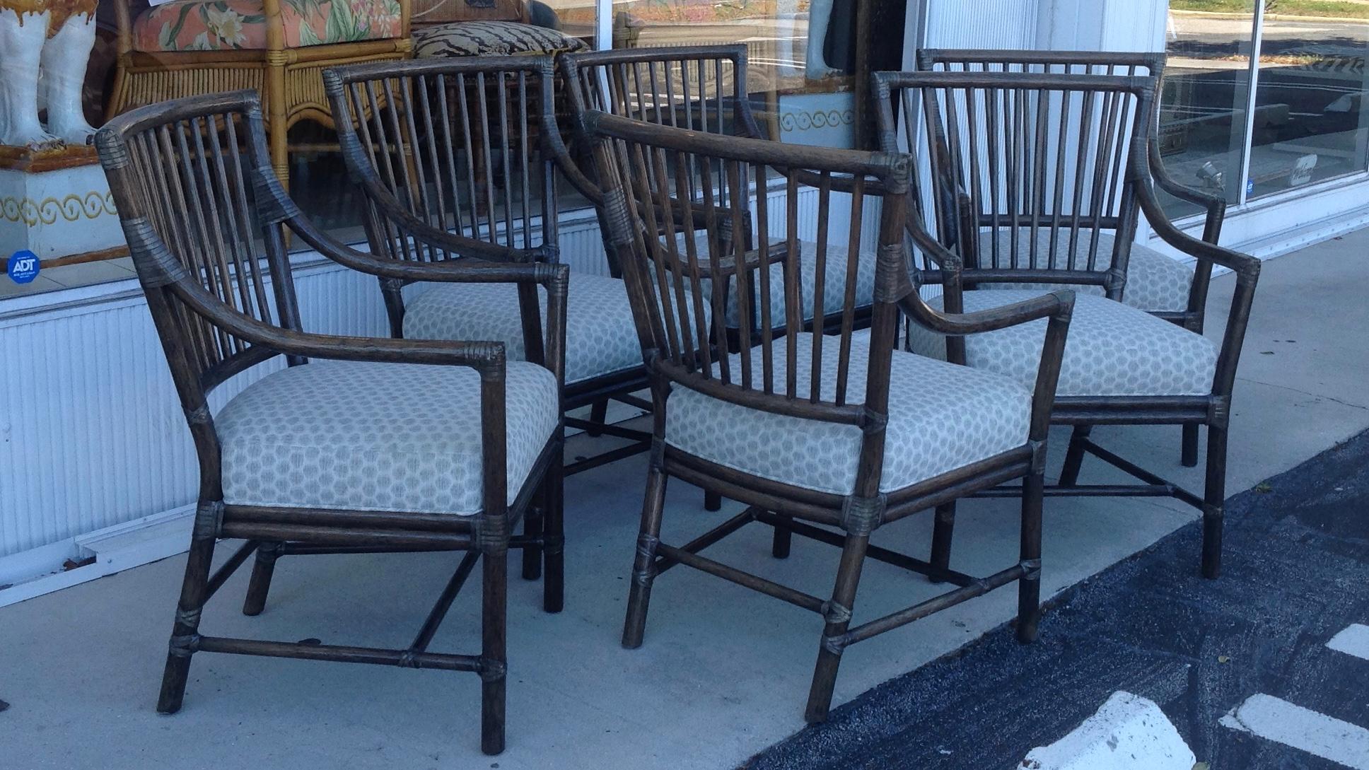 Elegant and Classic design finished with a rich dark olive hue. Each chair bears its original metal McGuire tag.