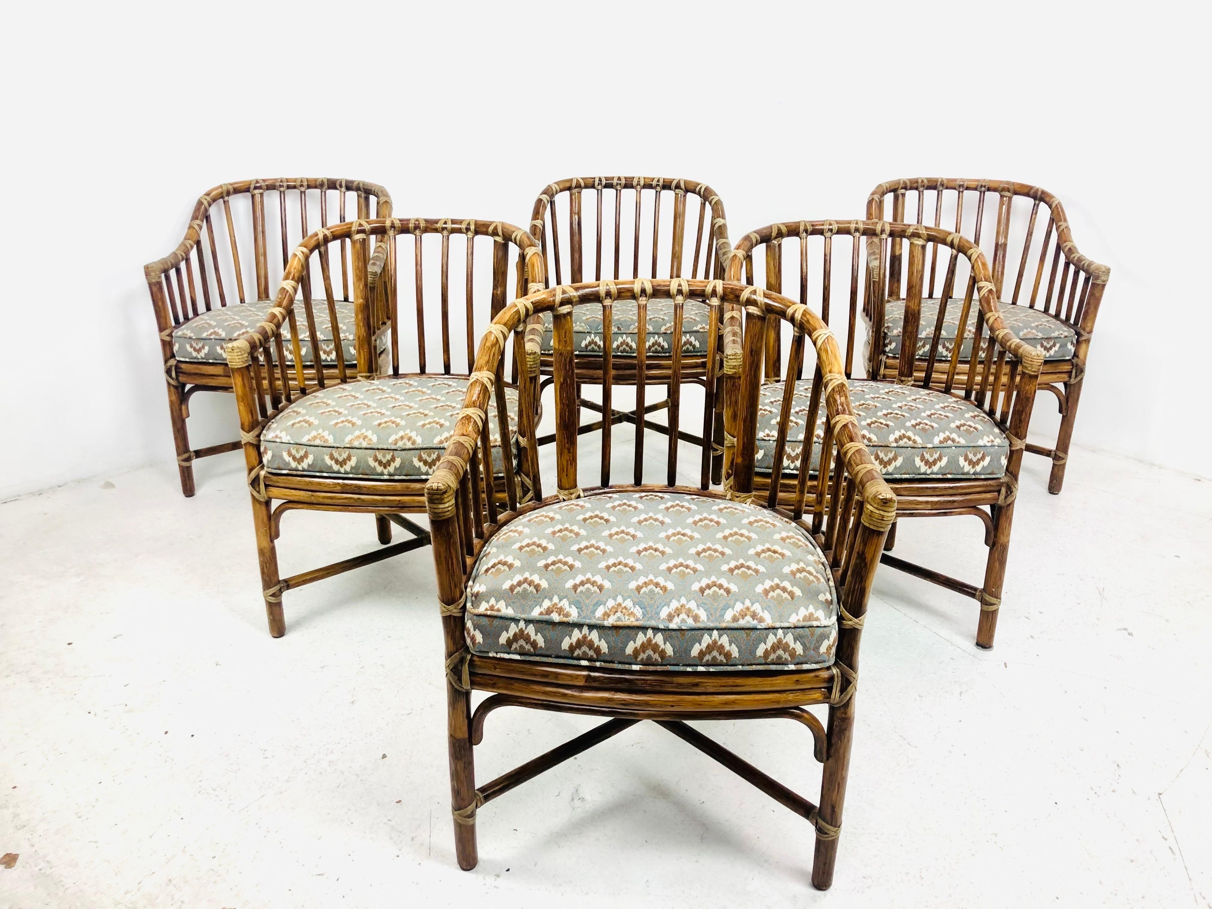 Fantastic set of 6 McGuire rattan dining chairs. Sturdy and in great vintage condition with original brass tags.