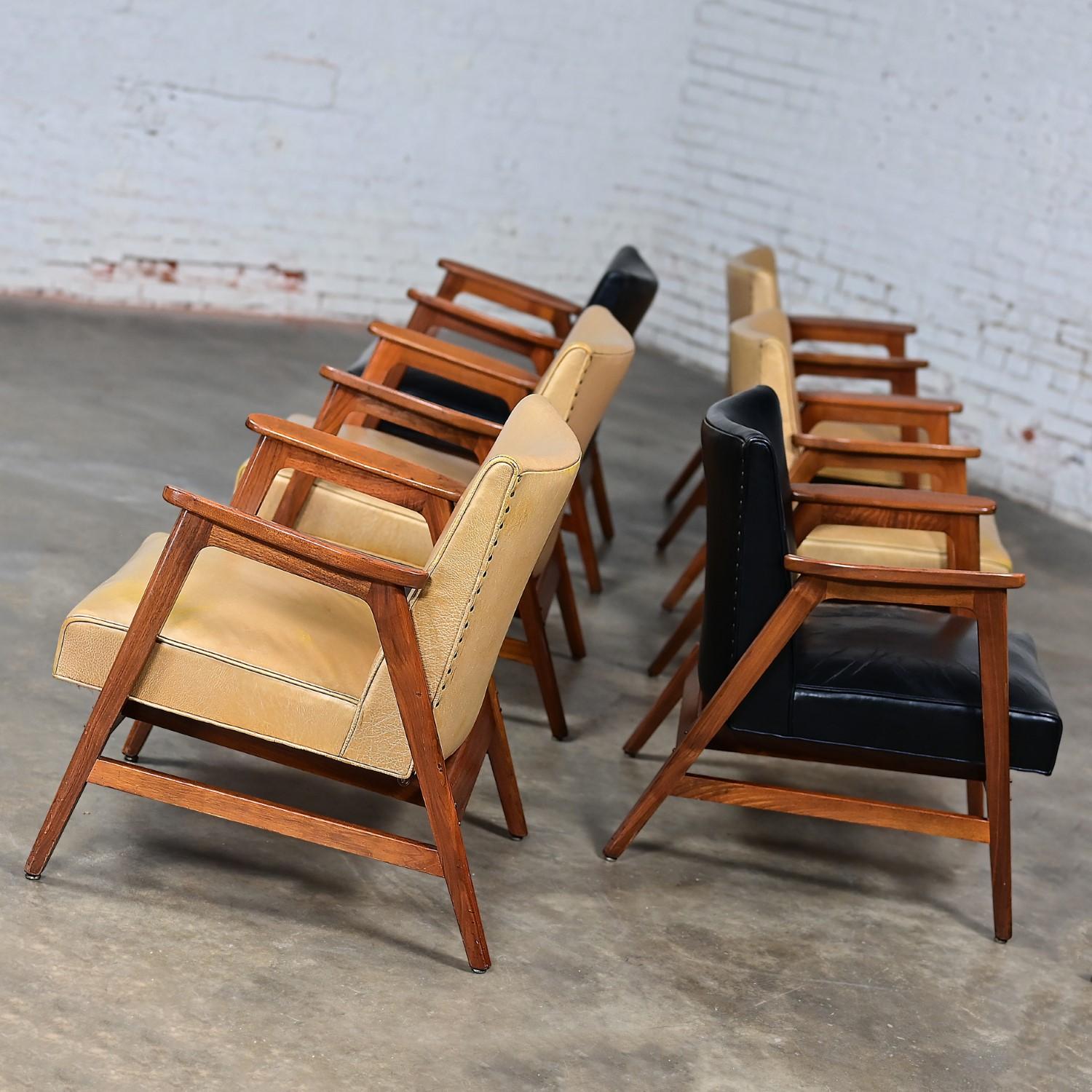 Handsome vintage MCM or Mid-Century Modern Gunlocke armchairs set of 6 comprised of walnut frames 4 with gold & 2 black leather seats & backs with nail head details. Beautiful condition, keeping in mind that these are vintage and not new so will