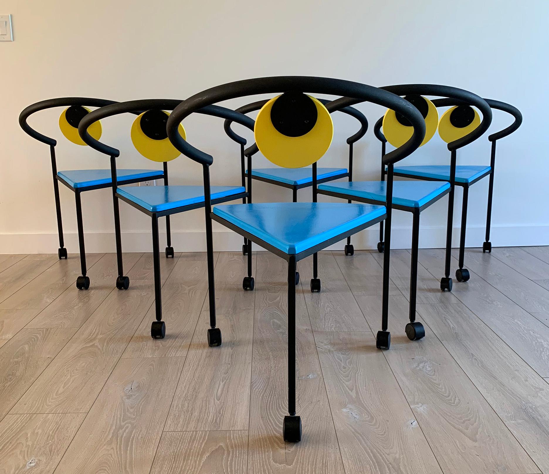 An eye-popping gorgeous set of 6 Memphis Milano style dining chairs from the 1990s! These vintage chairs are in great condition and really give off that fun Postmodern vibe from the 1990s. Very Michele De Lucci, Ettore Sottsass, or Peter Shire in