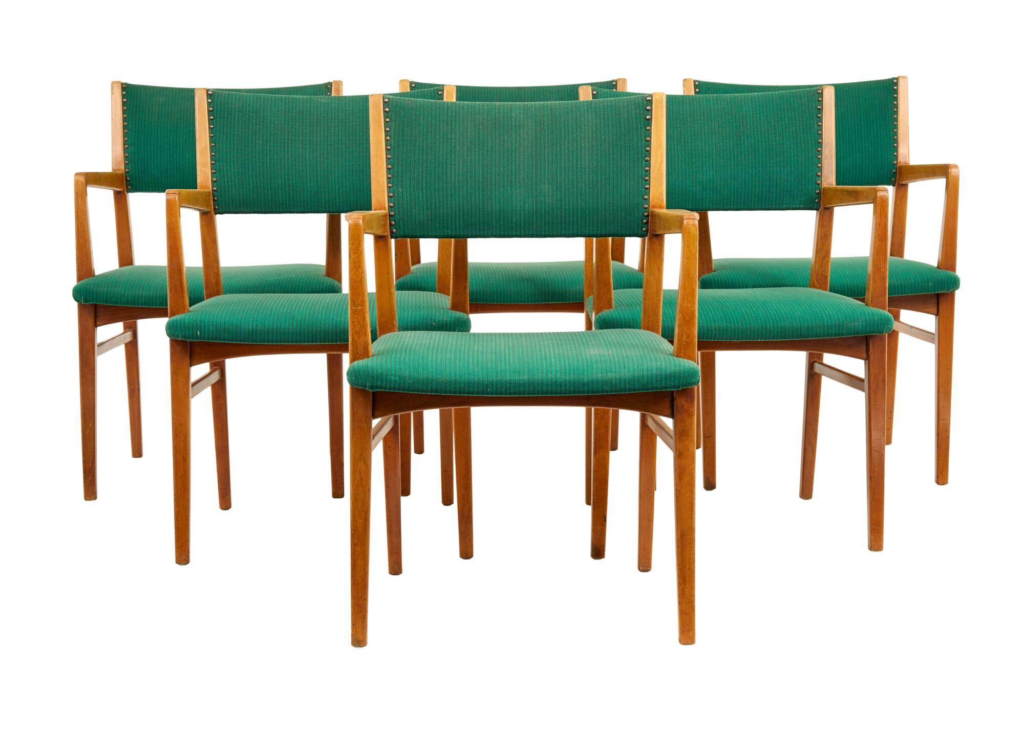 Set of 6 mid 20th century Scandinavian armchairs circa 1960.

Good quality set of Swedish office chairs which could now serve well as dining chairs.  Very comfortable and made in solid beech.  Upholstered in contrasting green fabric.

Surface marks