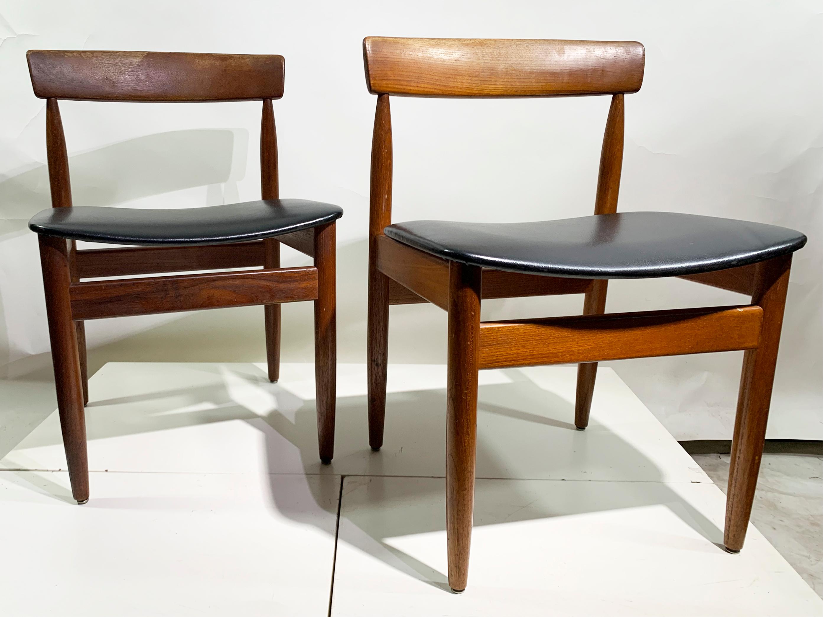 Exemplifying the essence of mid-century modern design, these Scandinavian dining chairs showcase meticulous craftsmanship. Each chair features a gracefully curved solid paddle backrest paired with sculptural supporting legs, creating a harmonious