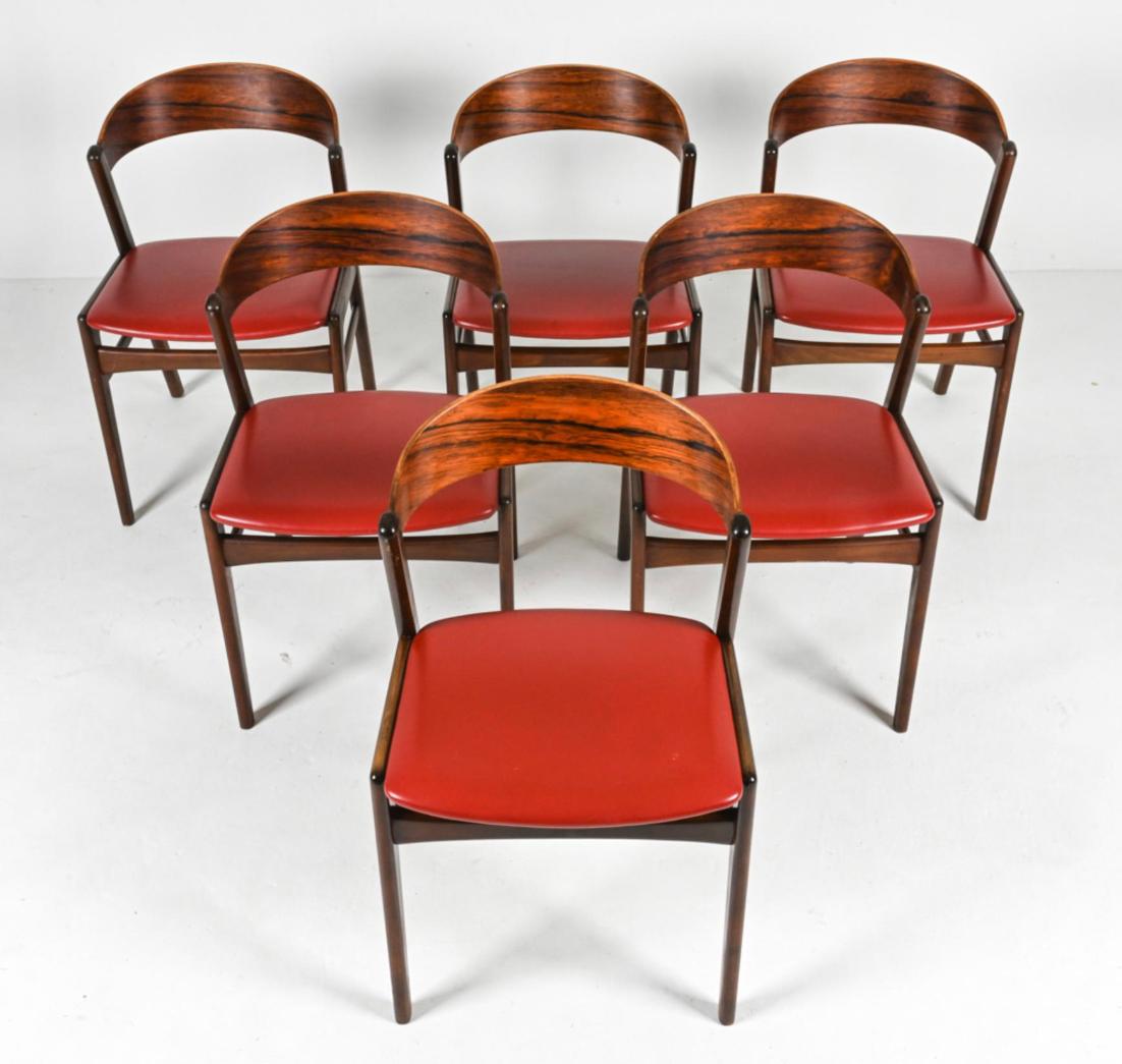 Rare set of (6) Model 26 ribbon back dining chairs in rosewood / teak and red vinyl upholstery designed by Kirkegaard for Hong Stolefabrik. Made in Denmark Circa 1960. Located in Brooklyn NYC

Dimensions: H 29.5