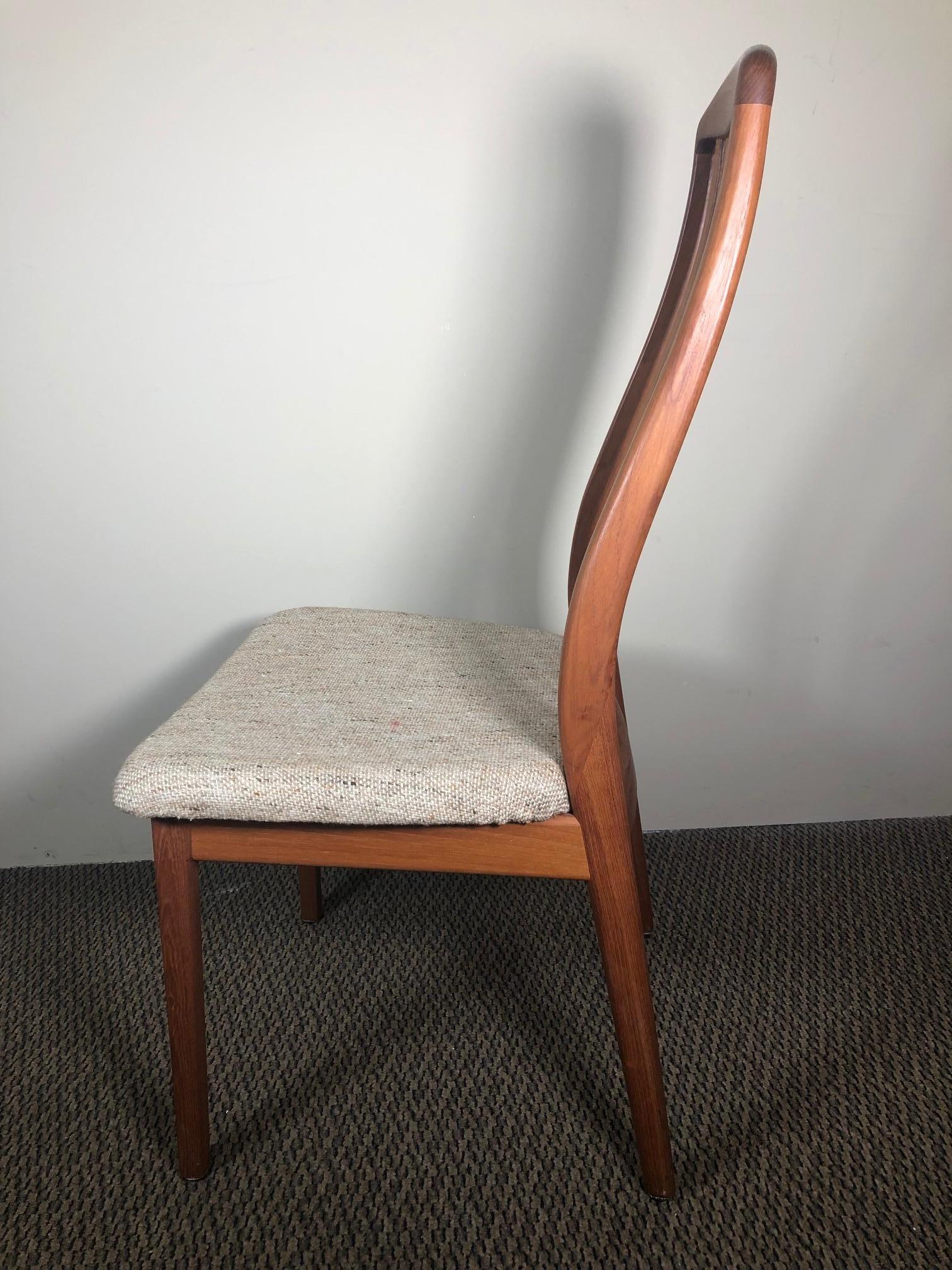 This is a set of 6 Danish teak dining chairs made by Dyrlund.
Excellent vintage condition with only minor marks here and there from normal use.
The upholstery appears to be original and could easily be changed to match your décor.
Stamped 'Made