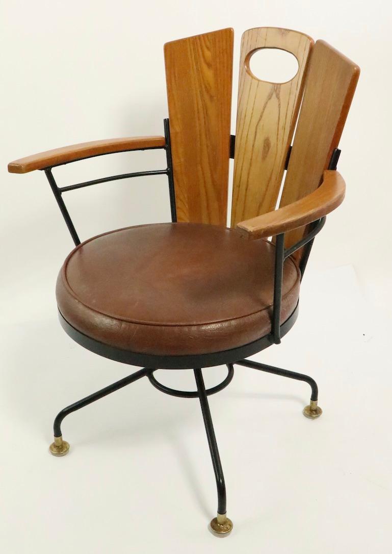 Set of six matching arm dining height chairs designed by Richard McCarthy. Unusually clean, ready to use, hard to find sets of six. Mid-Century Modern design while incorporating rustic warmth and style. Offered and priced as a set.
Measures: Total