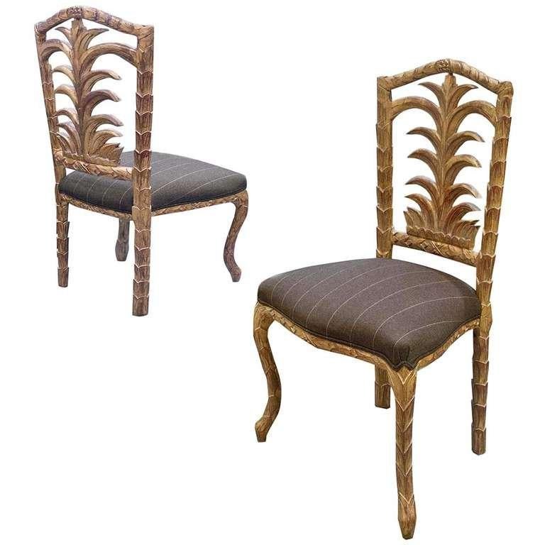 Handmade, antique dining chairs.  
Wonderful mid-century design
Back feature of a open palm.
Gesso material with distressed gold leaf finish
Upholstered with chalk pinstripe fabric from celebrated designer Andrew Martin featuring a dark grey