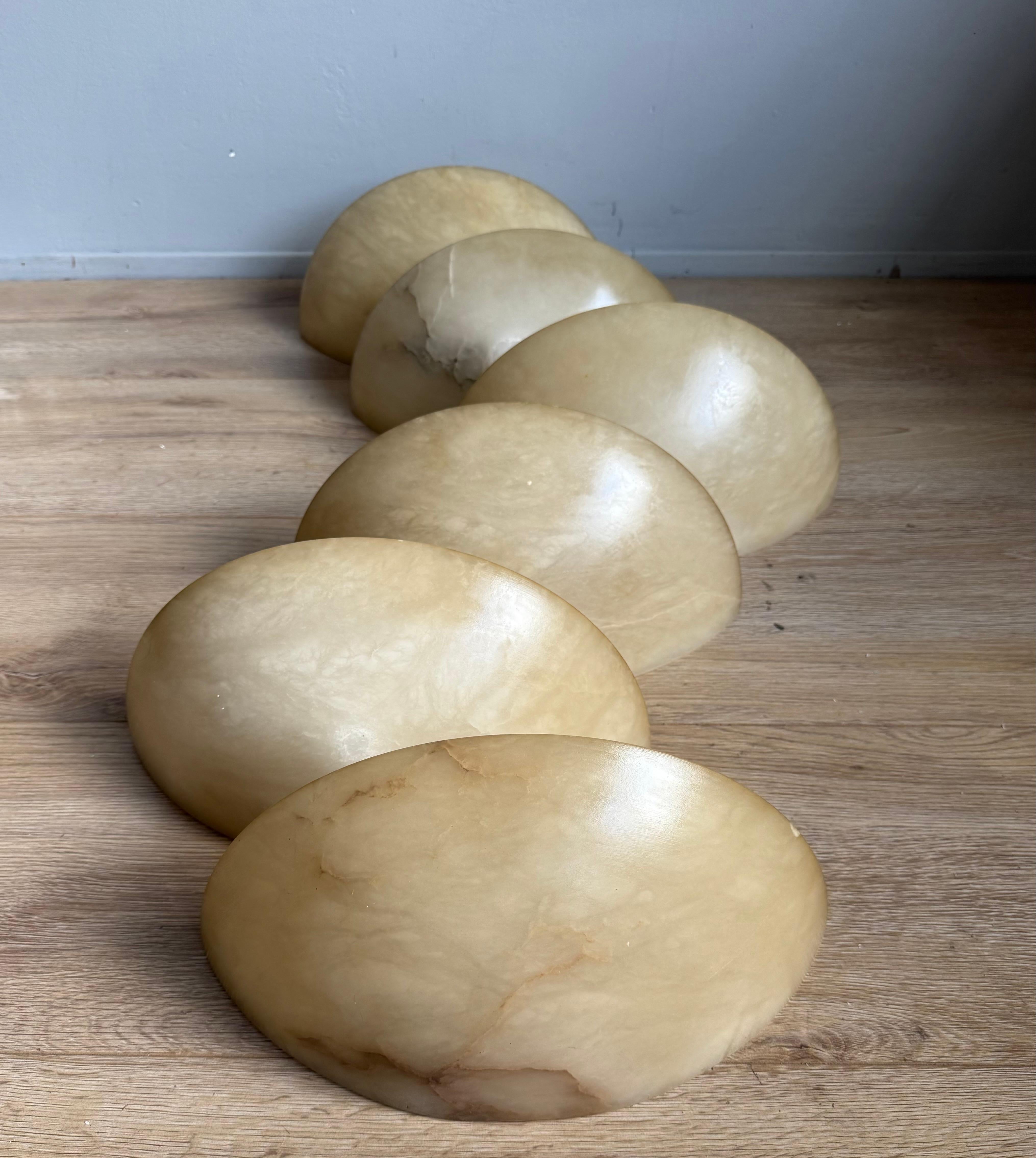 Ideal collection of 6 alabaster wall lamps for a project.

Because of their timeless design and warm light creating qualities, we have owned and sold many alabaster light fixtures over the years. There is something about the look and feel of these