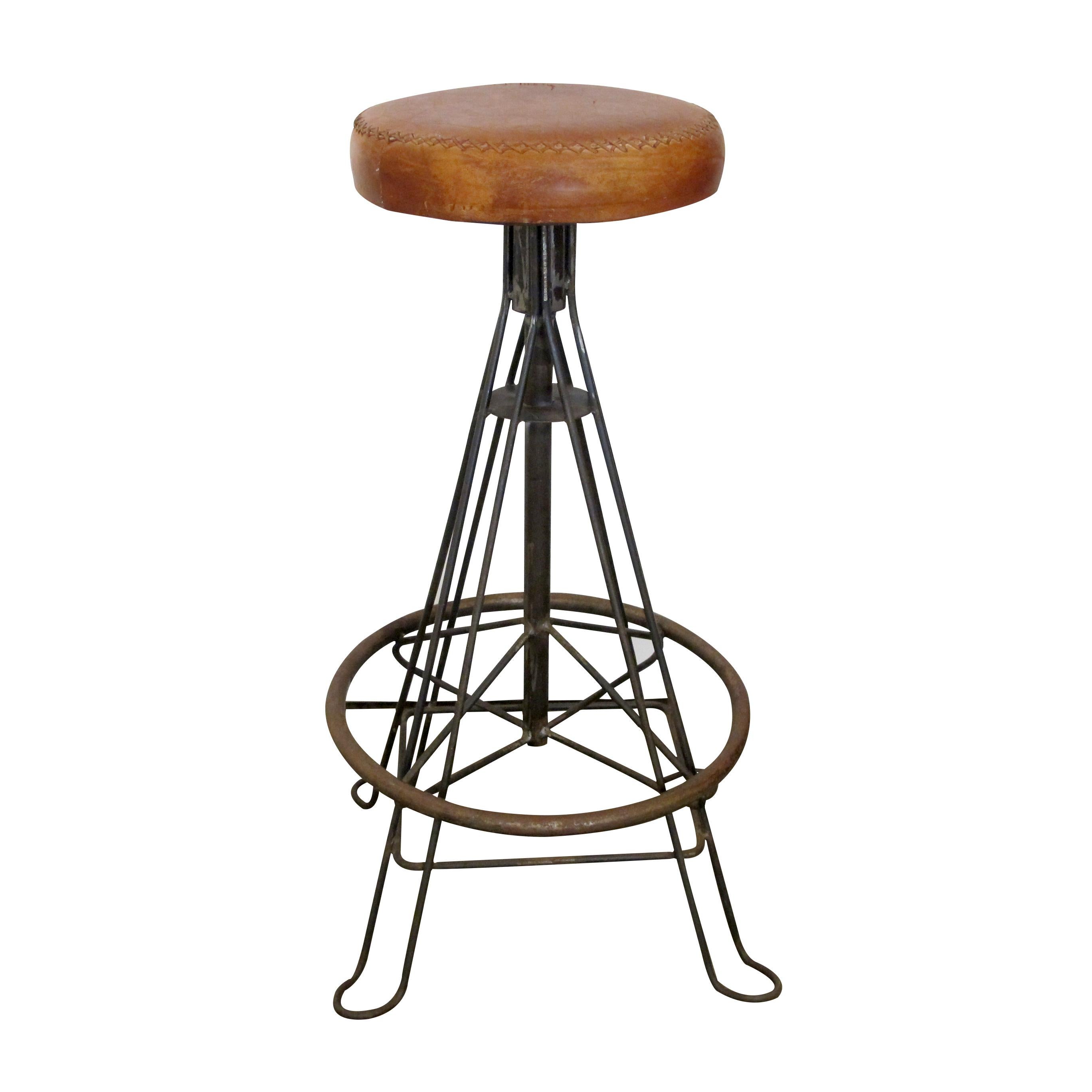 A beautiful set of six handmade wrought iron bar stools with hand stitched leather cushions.  The stools are very well-made and well-balanced. The wrought iron has a rustic patinated finish.

Size: Height: 76 cm x Diameter 40 cm (footrest circular