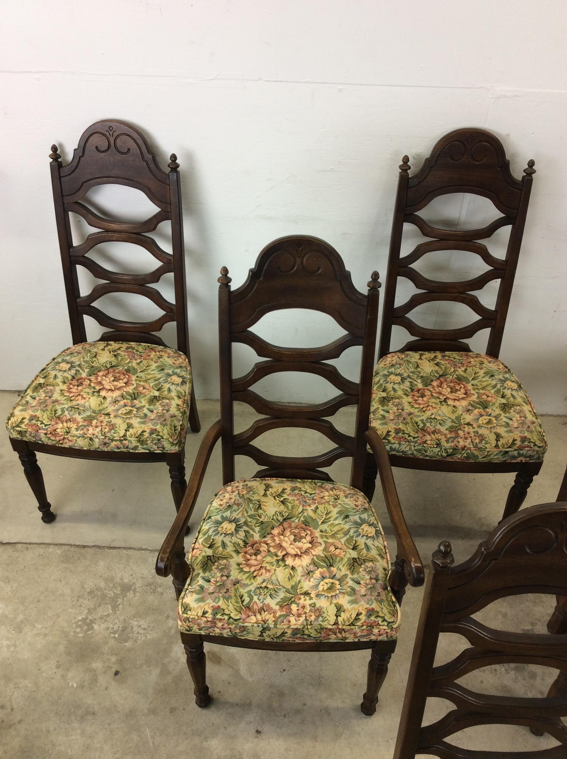 This set of 6 mid century modern dining chairs features hardwood construction, original walnut finish, high back design with unique open back design, vintage floral upholstery, and tall tapered legs.

Dimensions: 20w 25d 43.5h 19sh
