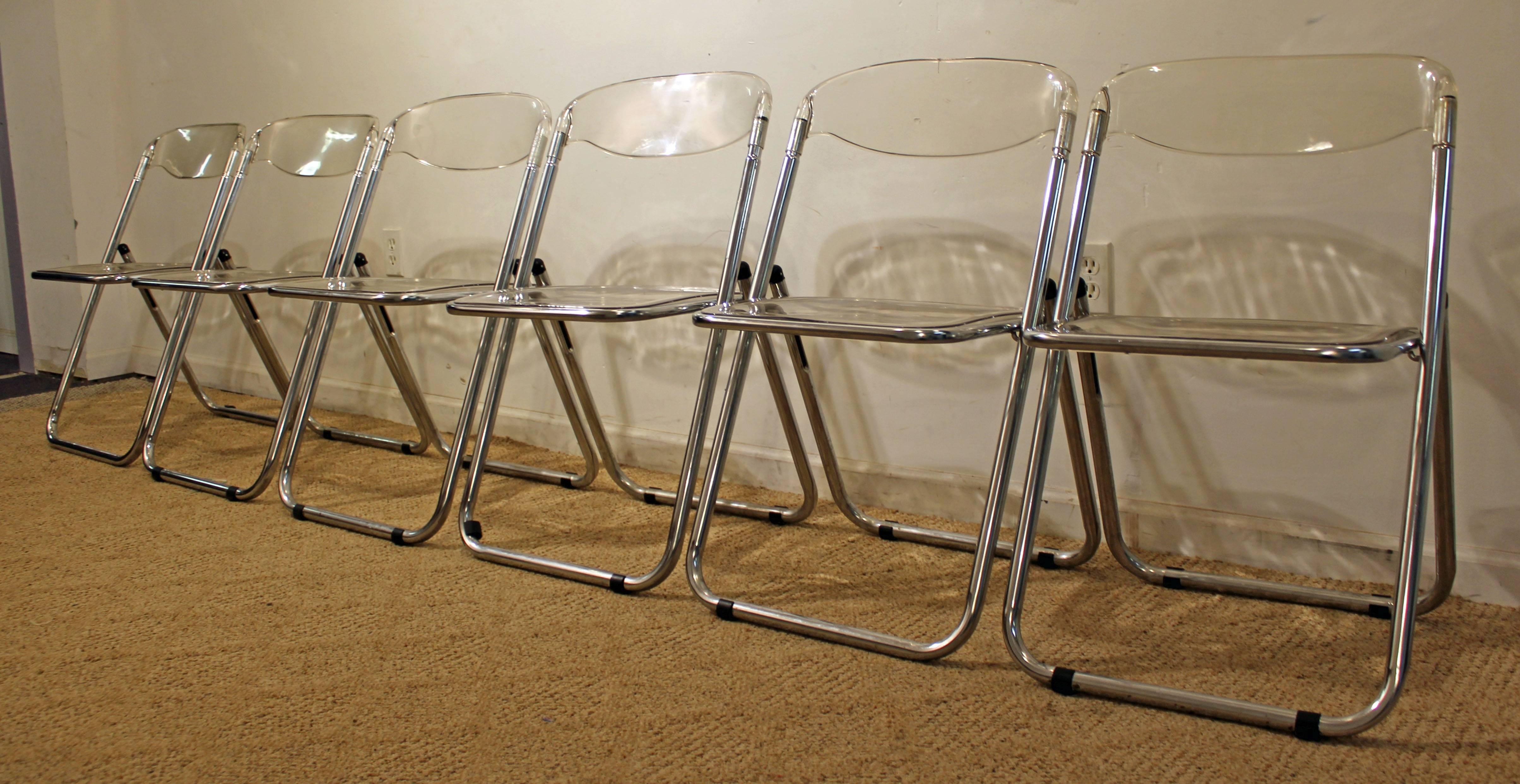 Offered is a set of six Mid-Century Modern Lucite and chrome folding chairs. They are in good condition, showing some normal age wear. They are not signed.


Approximate dimensions:
18.5
