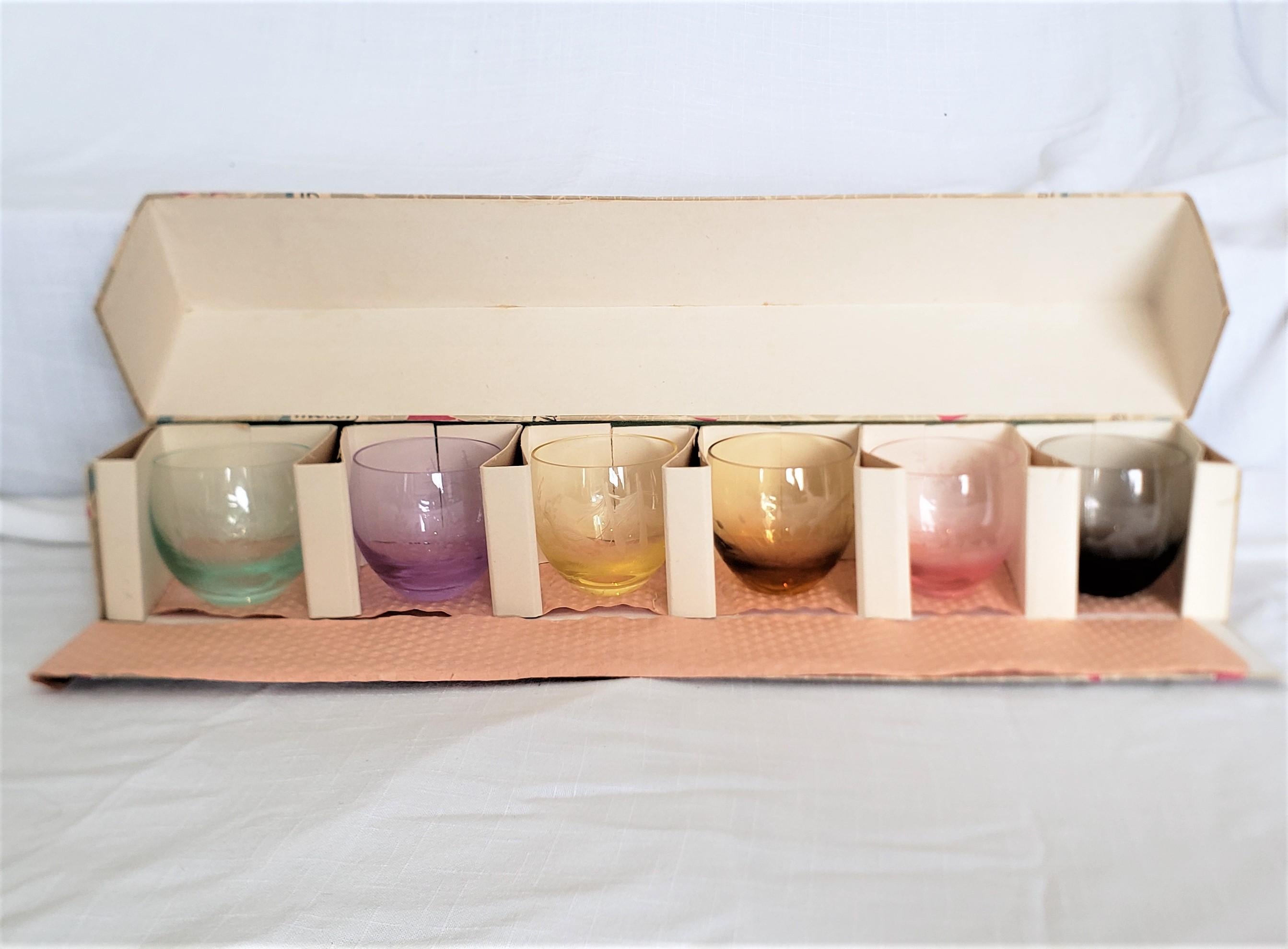 This set of six etched crystal multi-colored bar glasses were made by the renowned Moser glass factory of the Czech Republic in approximately 1965 in a period Mid-Century Modern style. Each of the six glasses in this set is done in a squat 'rolly