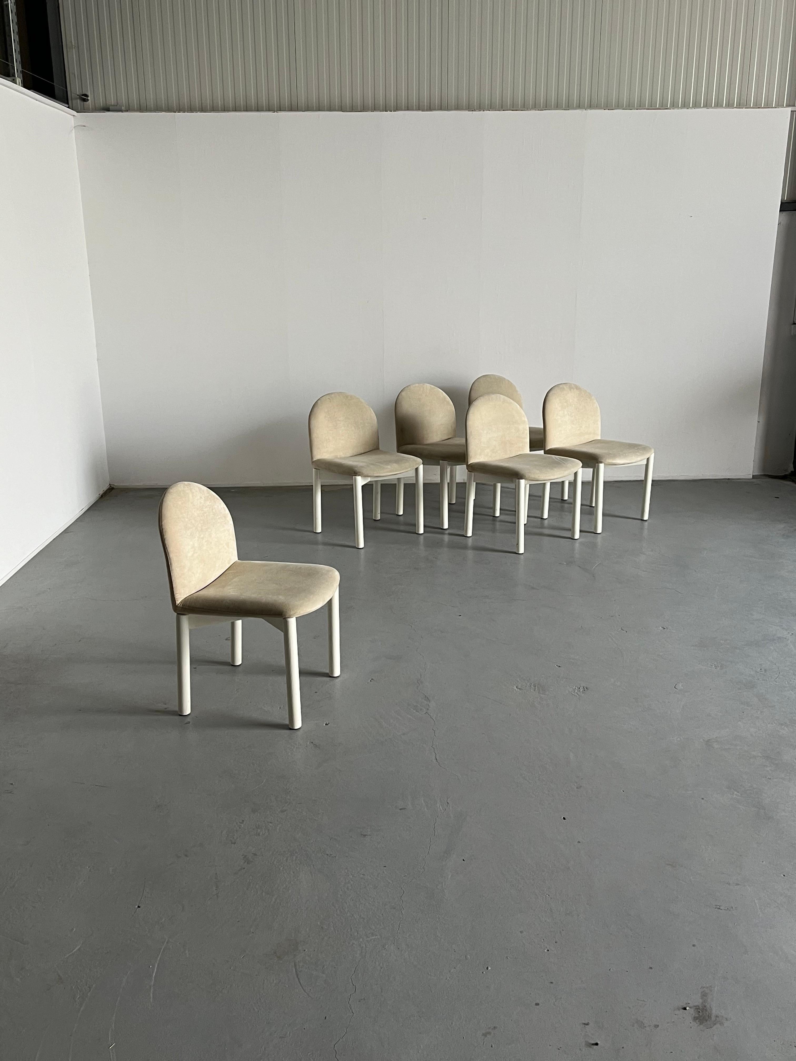 Set of six Mid-century modern 'Combra' chairs, produced by the iconic German furniture manufacturer COR, well known for their modular sofas and 1970s and 1980s designs.

Off white velvet upholstery and painted wood white base.
Simple, elegant,