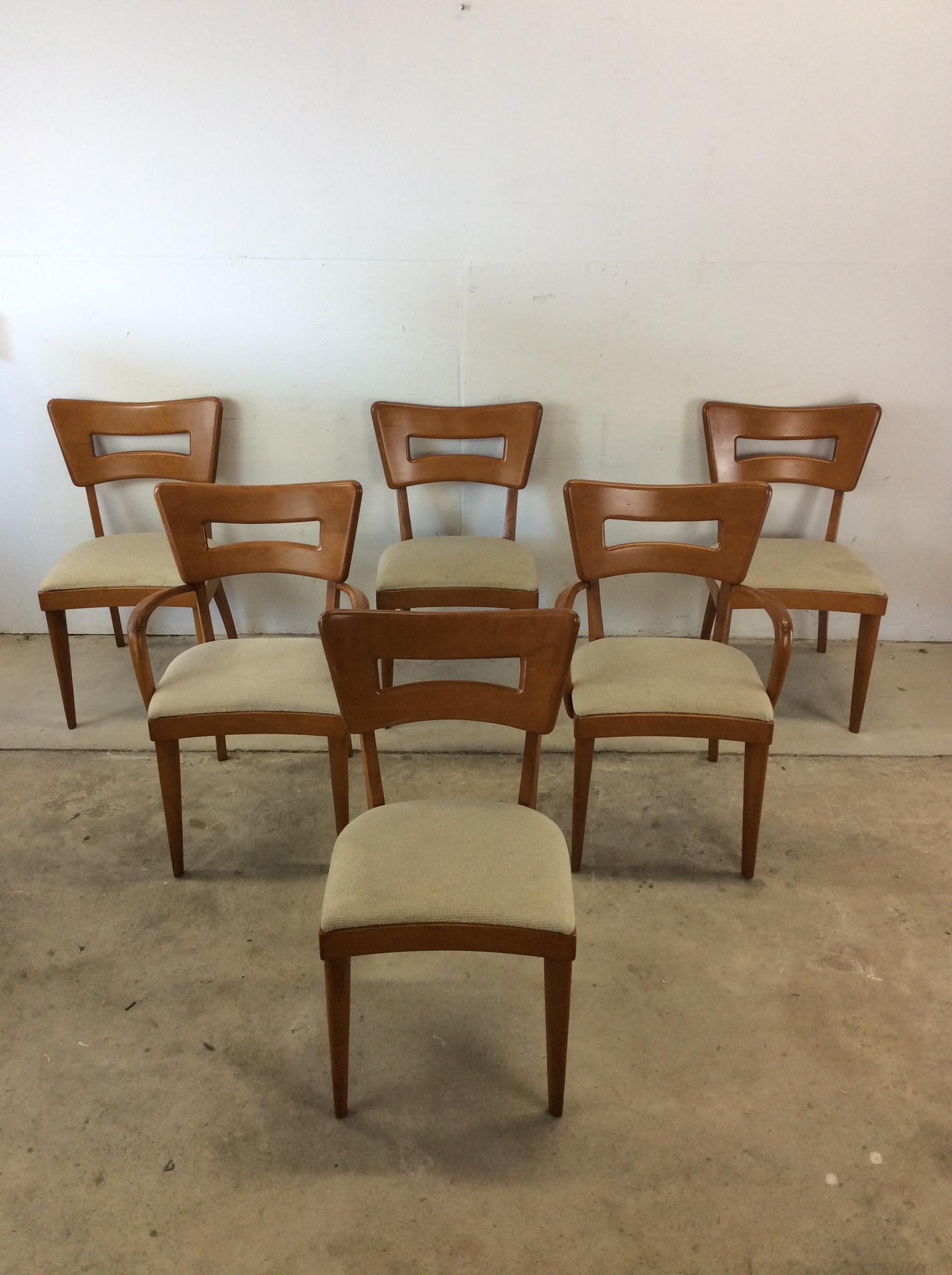 This set of 6 mid century modern dining chairs by Heywood Wakefield feature hardwood construction, original champagne finish, two arm chairs, four side chairs, tall tapered legs and vintage upholstered seats.  Arm chair: 22w

Dimensions: 20.5w 20.5d
