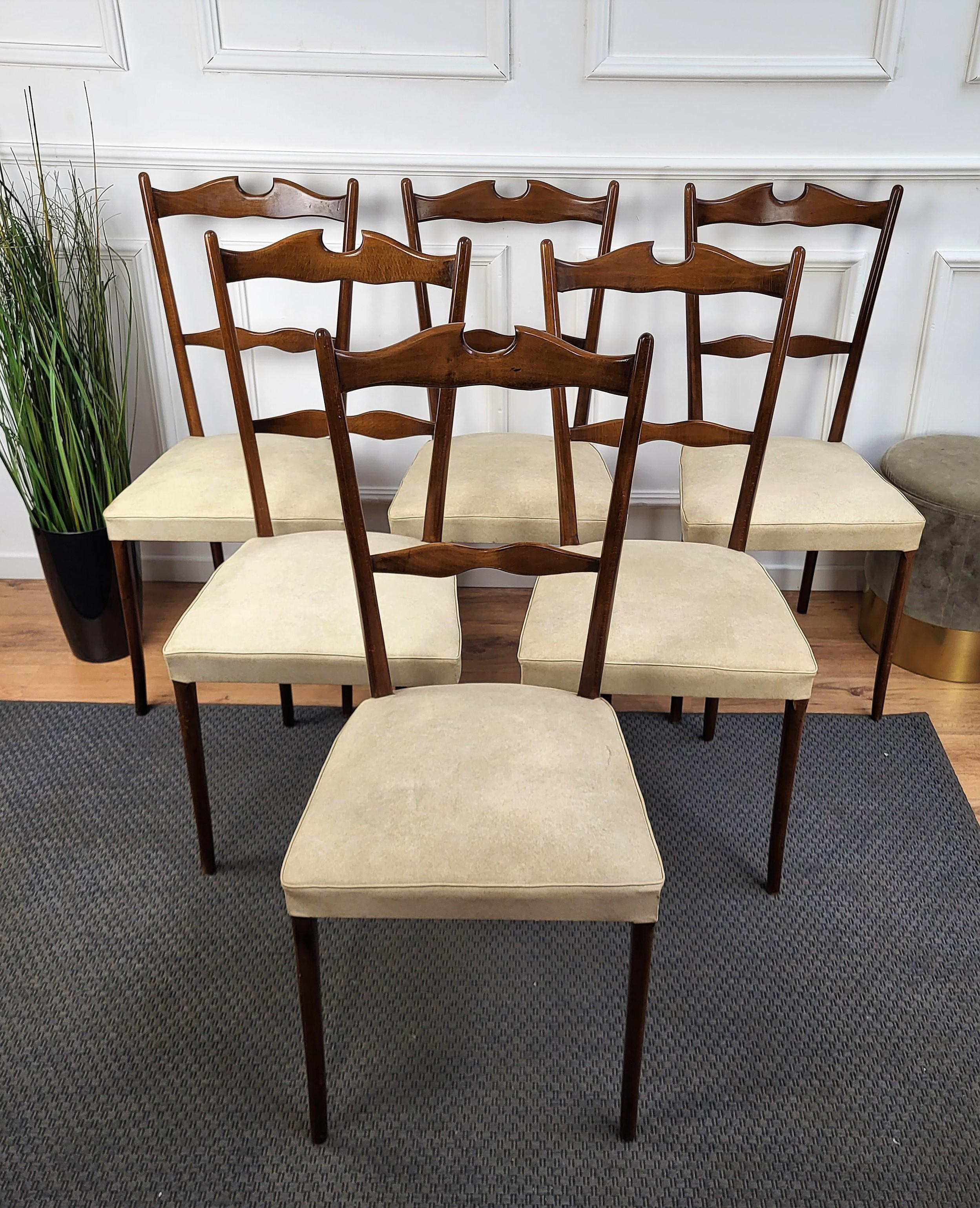 Very elegant Italian Mid-Century Modern set of 6 dining chairs, with greatly shaped wooden structure and upholstered seat. The unique and typical design, with the clean geometric shape and decoration enrich the natural pattern and grain of the wood