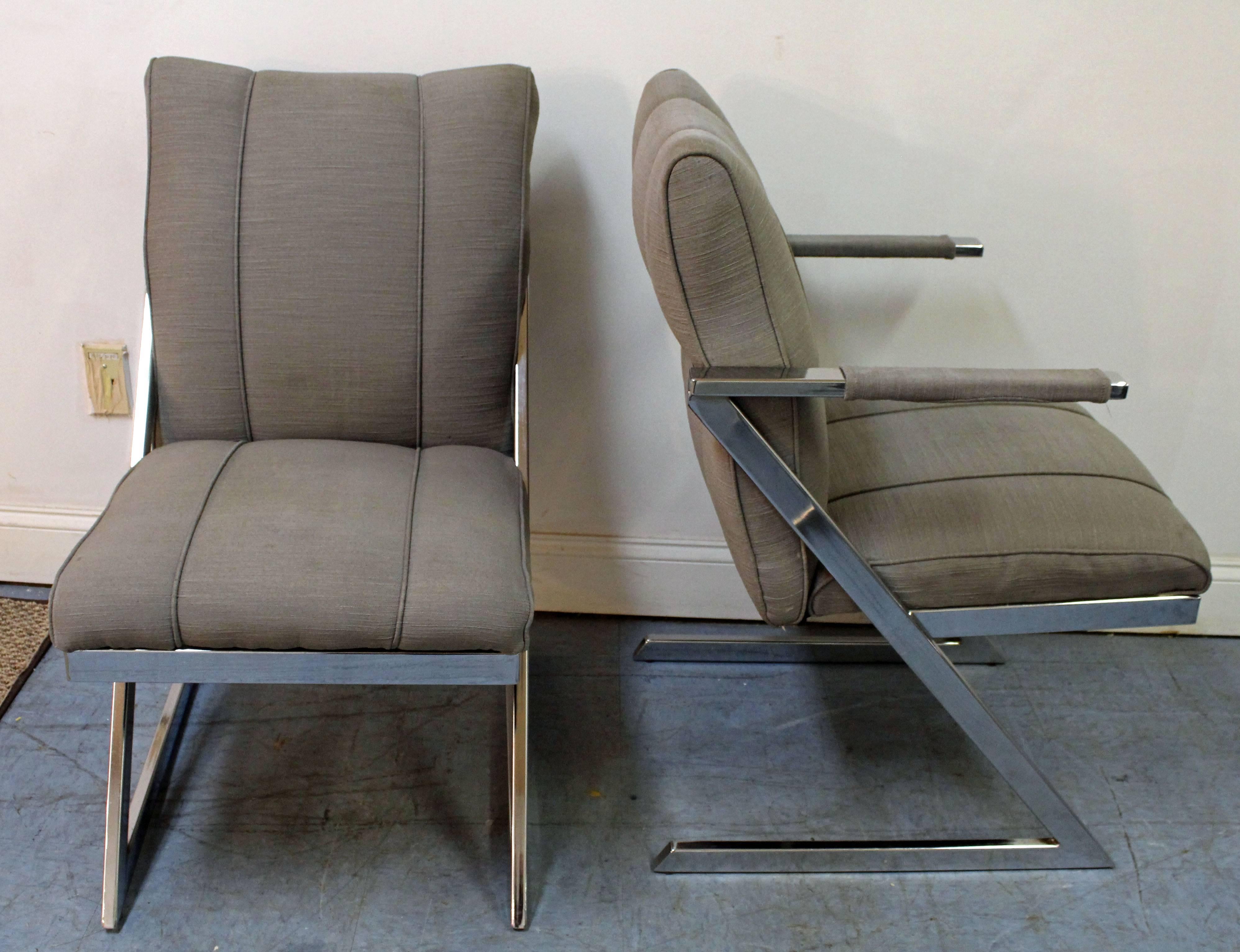 Offered is a set of six chrome dining chairs, by Design Institute of America (DIA). The chairs have a z-bar cantilevered base and are made of chrome. They are in great condition for their age, but show some age wear and can stand to be
