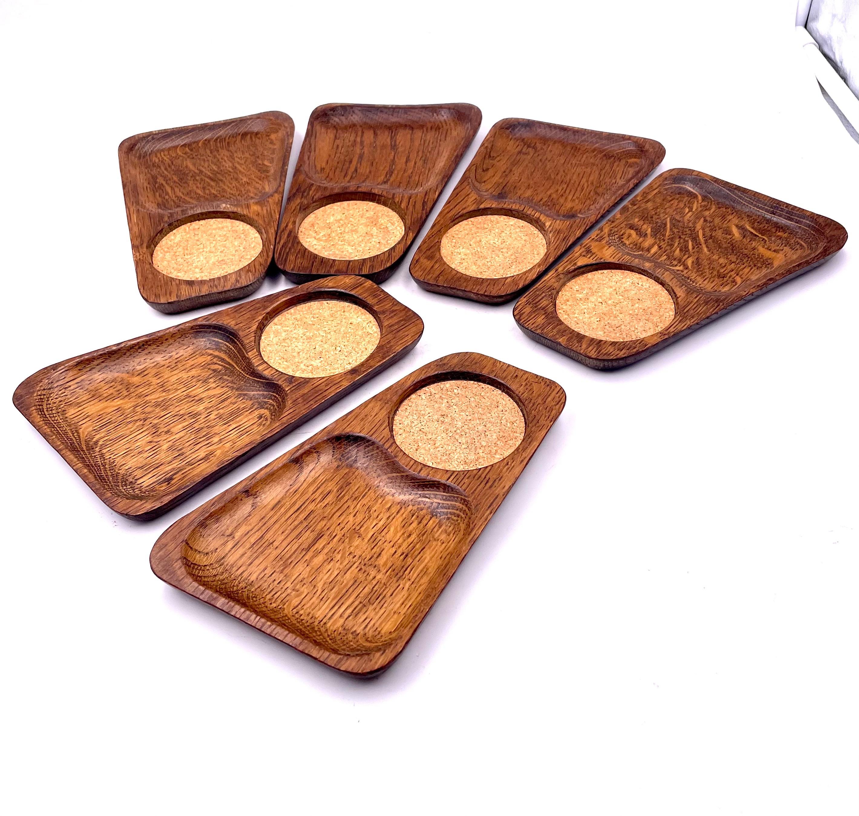 Nice set of 6 snack serving trays in the style of Don Shoemaker. Solid carved oak versatile with cork insert for a drink, great for parties.