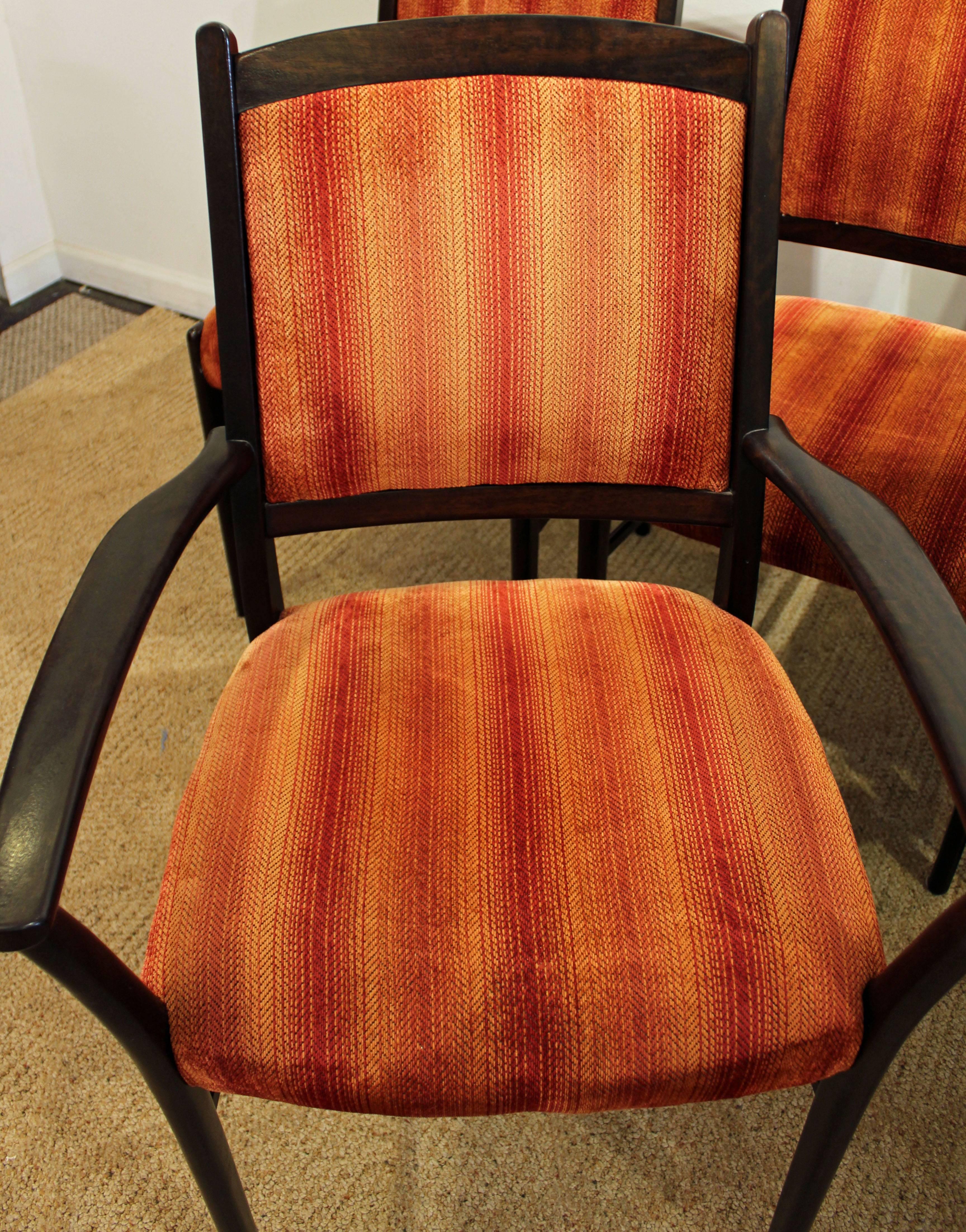 These chairs are made of rosewood. Includes two armchairs and four side chairs.

Dimensions:
armchairs: 23