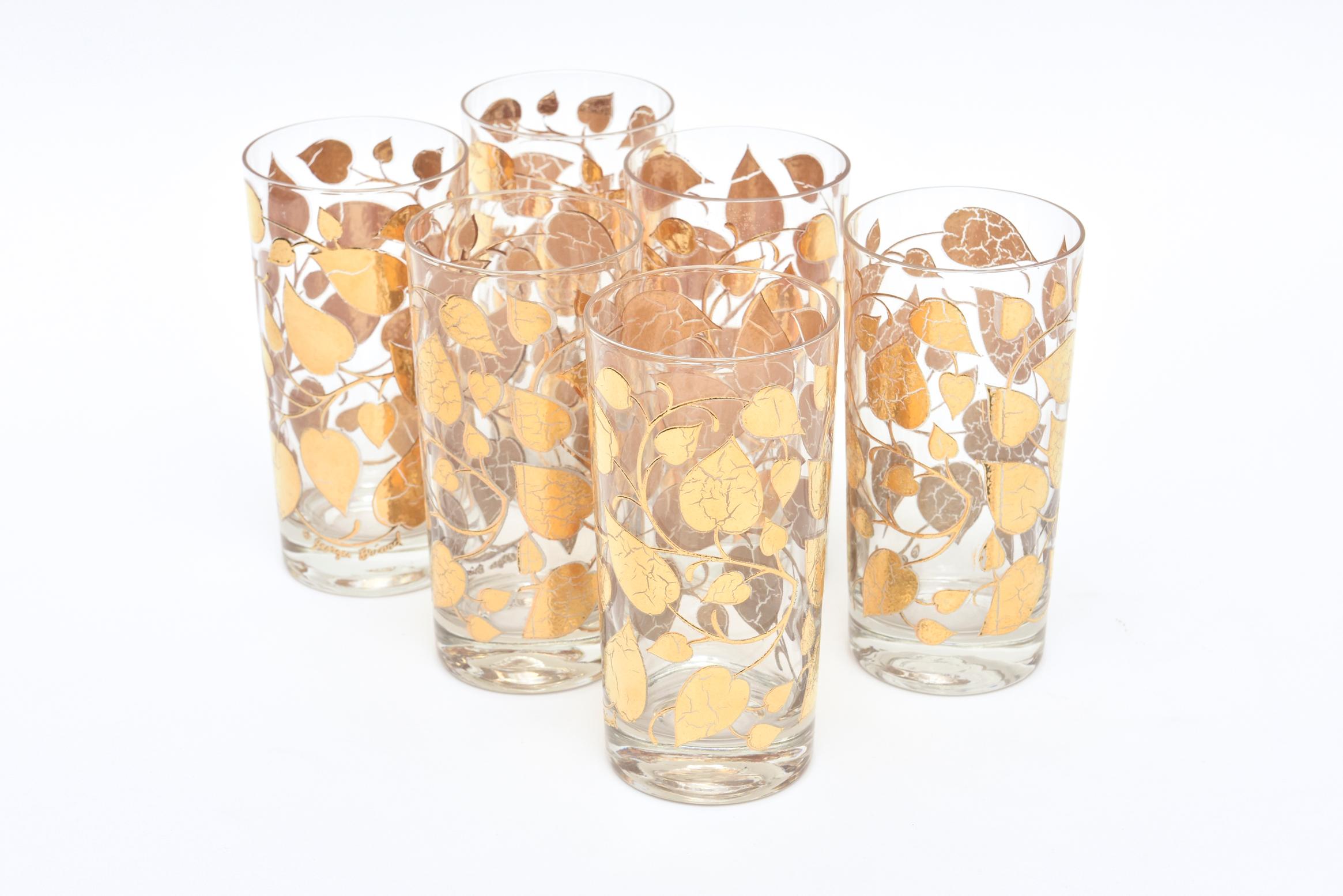 This Mid-Century Modern set of 6 signed Georges Briard highball glass barware are a pattern of applied gold painted overlay of leafs with detailed veining throughout the glass. These are from the 1960s and must be hand washed. They are not