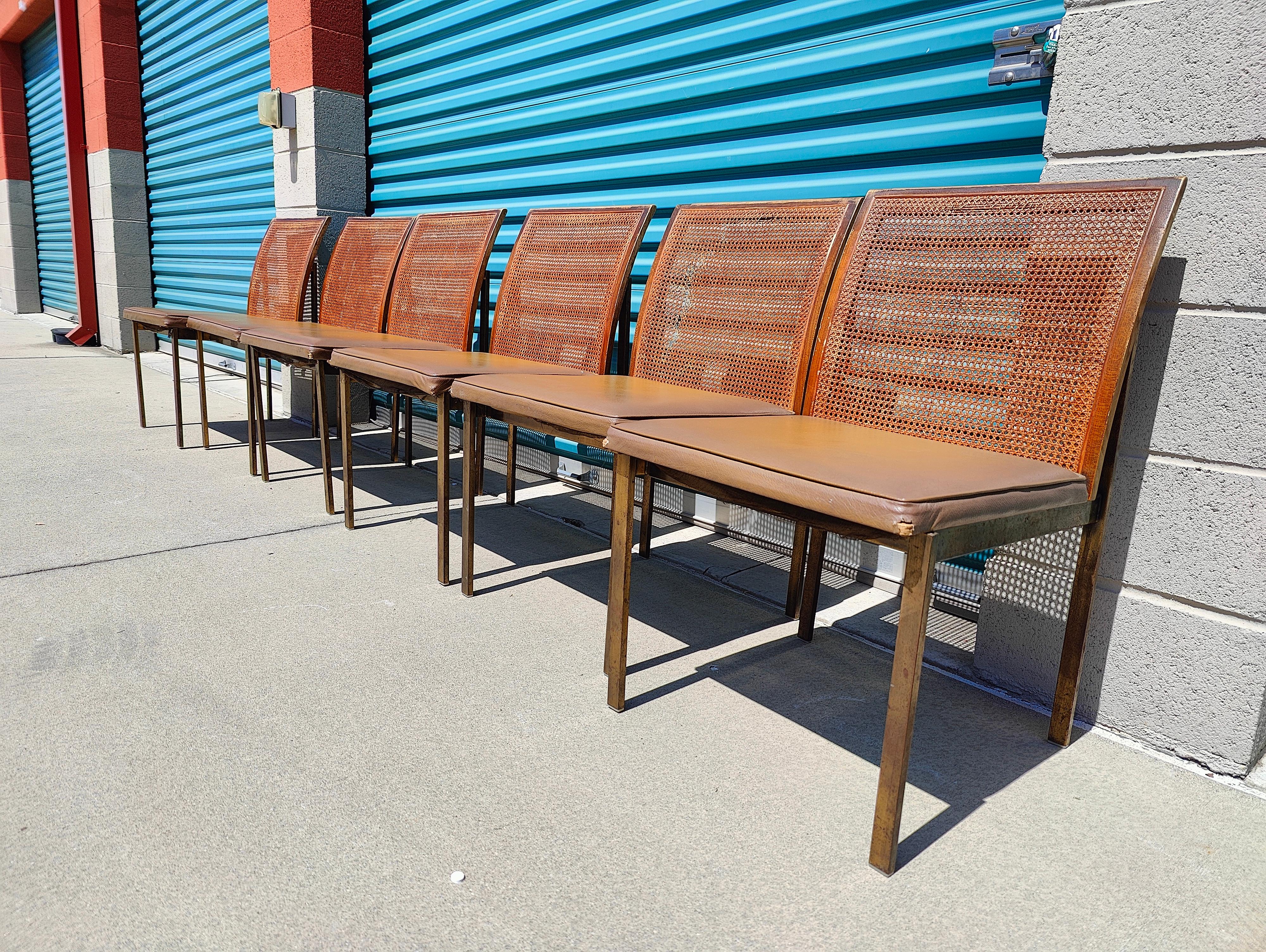 Now available, a stunning set of Roland Carter for Lane dining chairs. They feature a bronze metal frame, vinyl cushioned (that are well loved) and cane backing (Two of which have a break - please refer to pictures). Metal frame shows beautifully