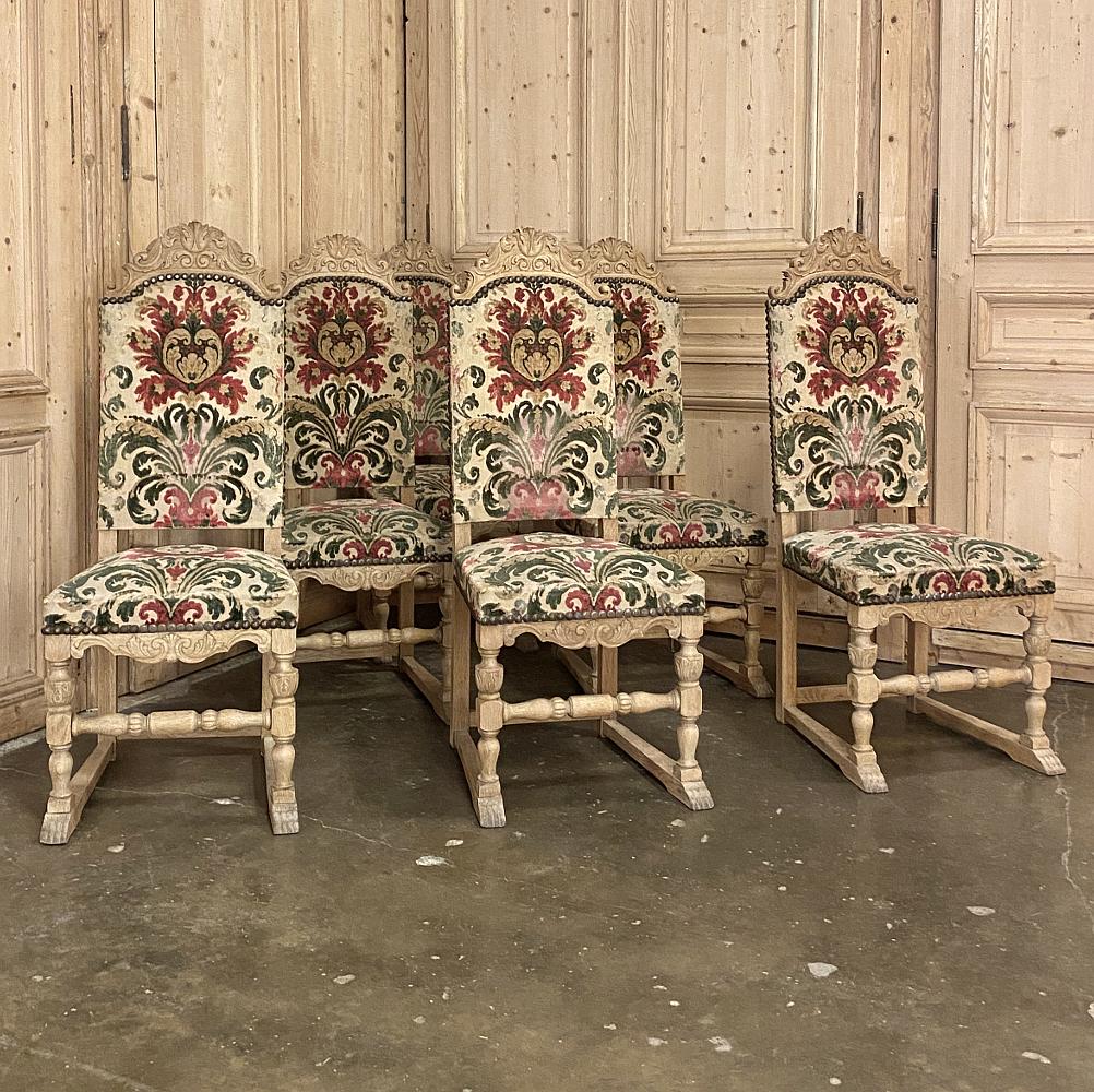 Set of 6 Mid-Century Renaissance revival dining chairs feature finely carved seatback crowns and finely turned legs and stretchers below, with a subtly carved apron. Generous seatbacks and seat provide ample comfort. Hand-crafted from solid