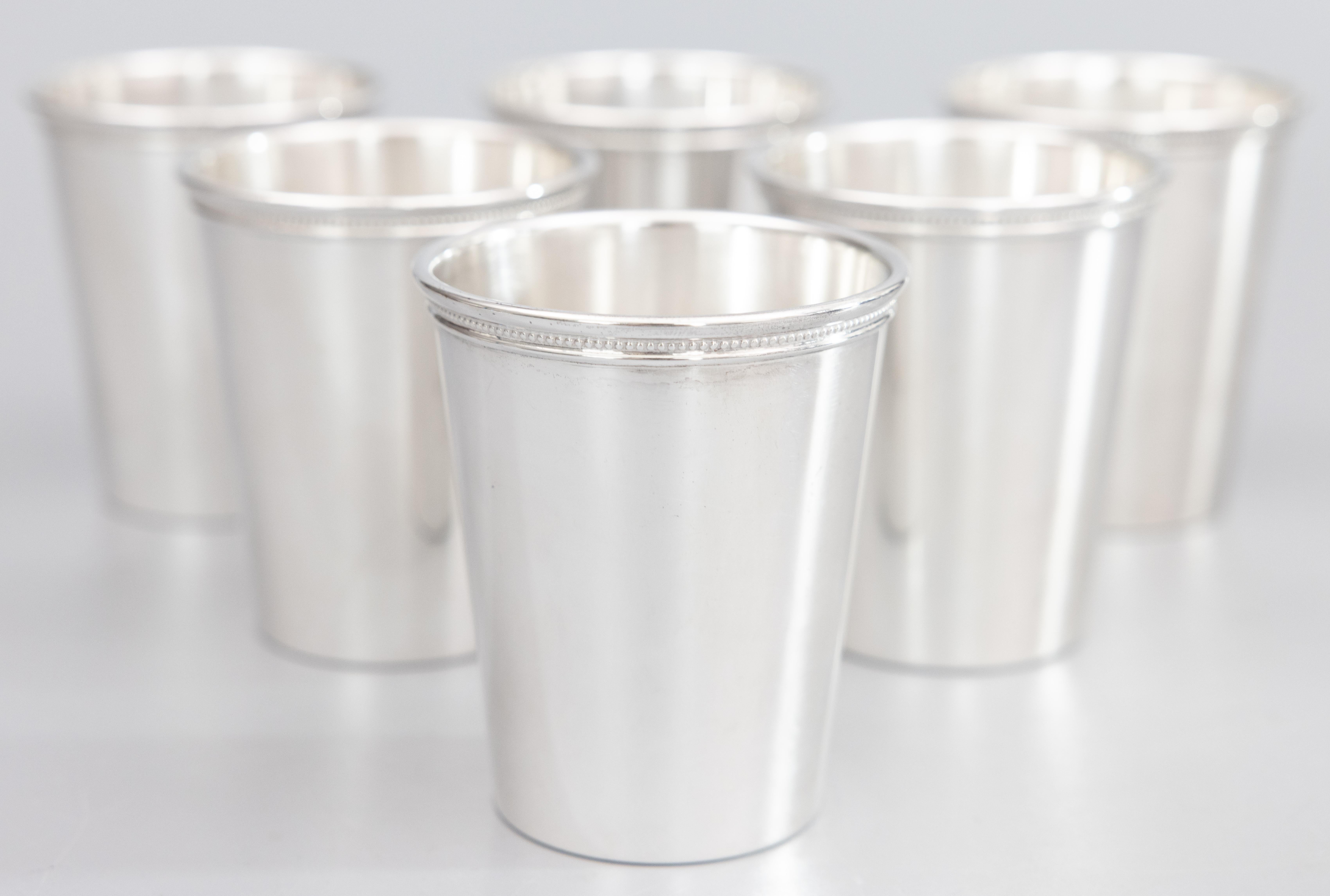 A superb Mid Century set of 6 silverplate mint julep tumblers by Wm Rogers. Marked on reverse. These fine cups are heavy and well made with a sleek design and decorative beaded detail around the rim. They would be a stylish addition to your barware