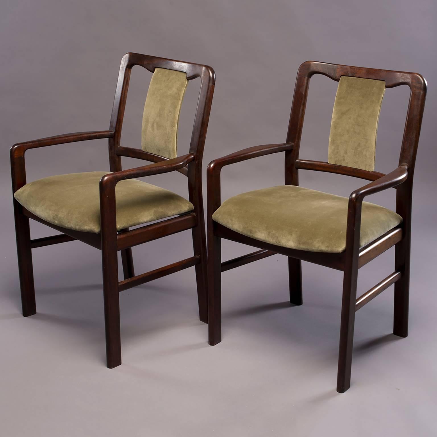 Set of six, circa 1970s Danish rosewood frame chairs includes two arm chairs and four side chairs. All seats and backs have been professionally upholstered in moss green velvet. Unknown Danish maker - overall very good vintage condition.