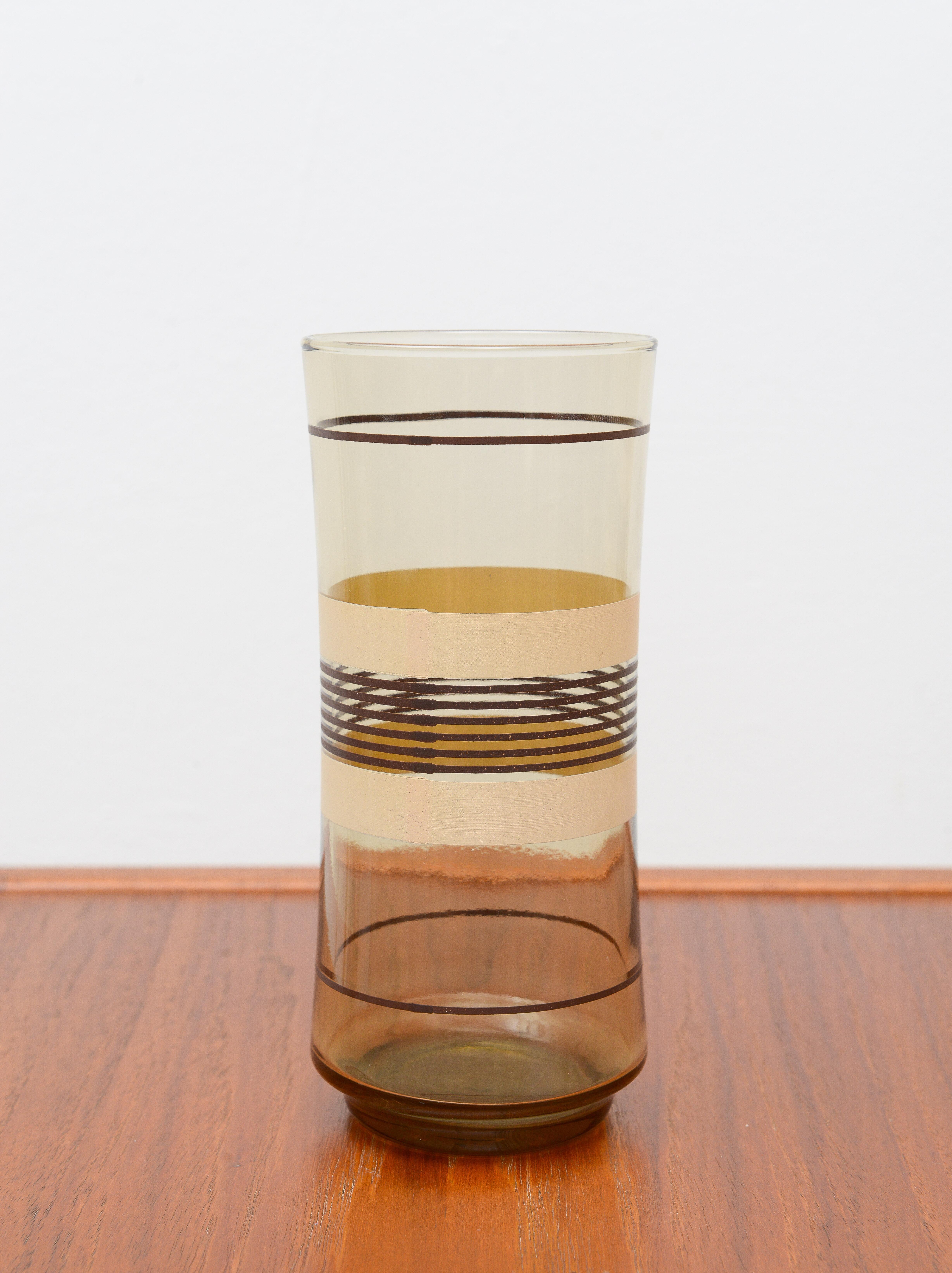 Set of 6 mid-century smoked brown glasses 1950s. The outside is decorated with varying widths of light and dark brown rings from the bottom to up to the top of the glasses.