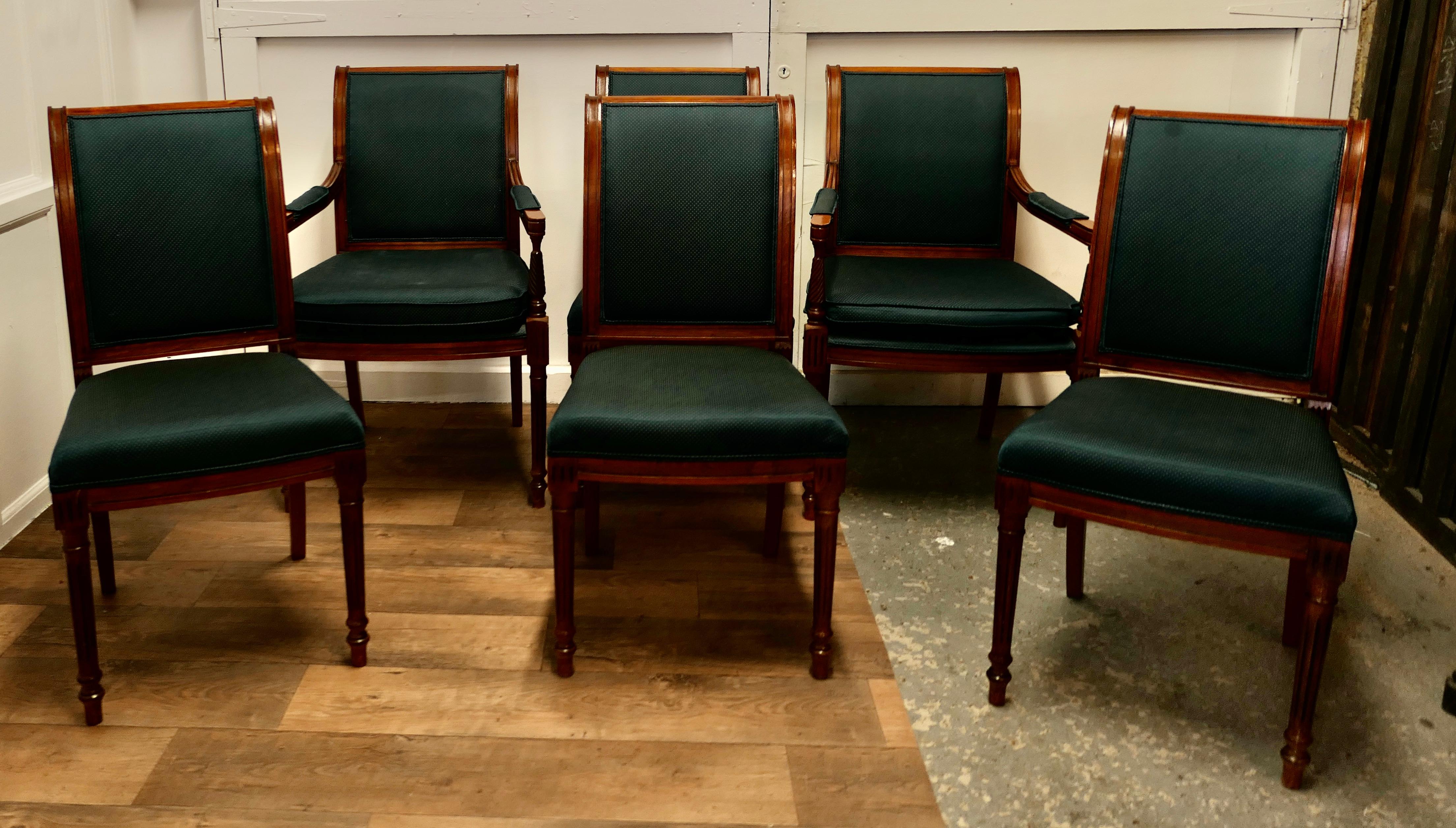 Set of 6 midcentury Teak Dining Chairs in the Regency Style

A Good Quality set of midcentury Teak Dining Chairs, including 2 carver chairs with removable cushions, the chairs have stout turned and reeded legs they are very solid and sound. The