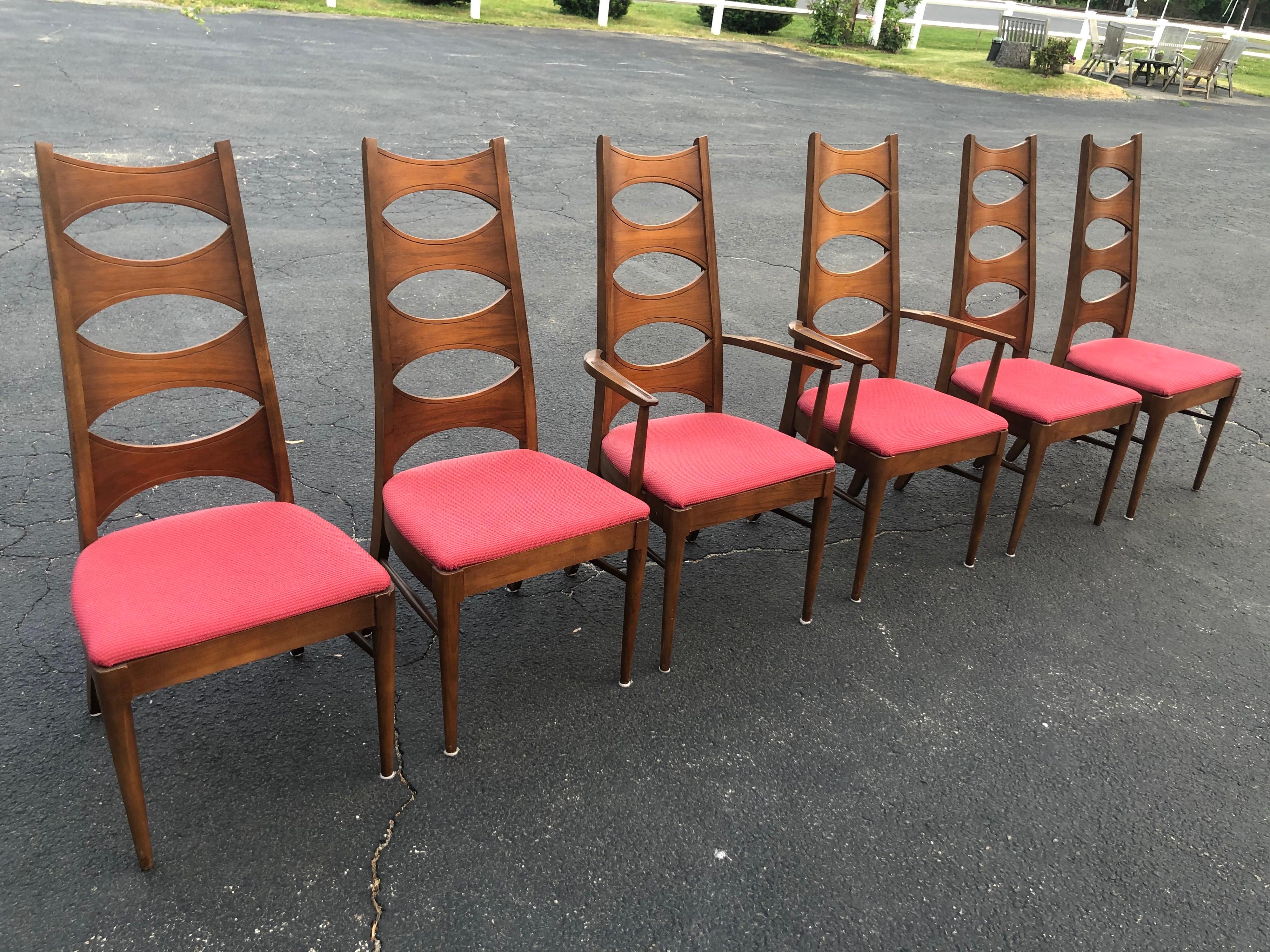 Set of 6 mid century walnut dining chairs by Kent Coffey. Rare set of his Perspecta Collection. Fabulous brutalist style and shape. 2 arm chairs and six side chairs. Sturdy and comfortable. Seats are covered in a berry colored sturday cotton fabric.