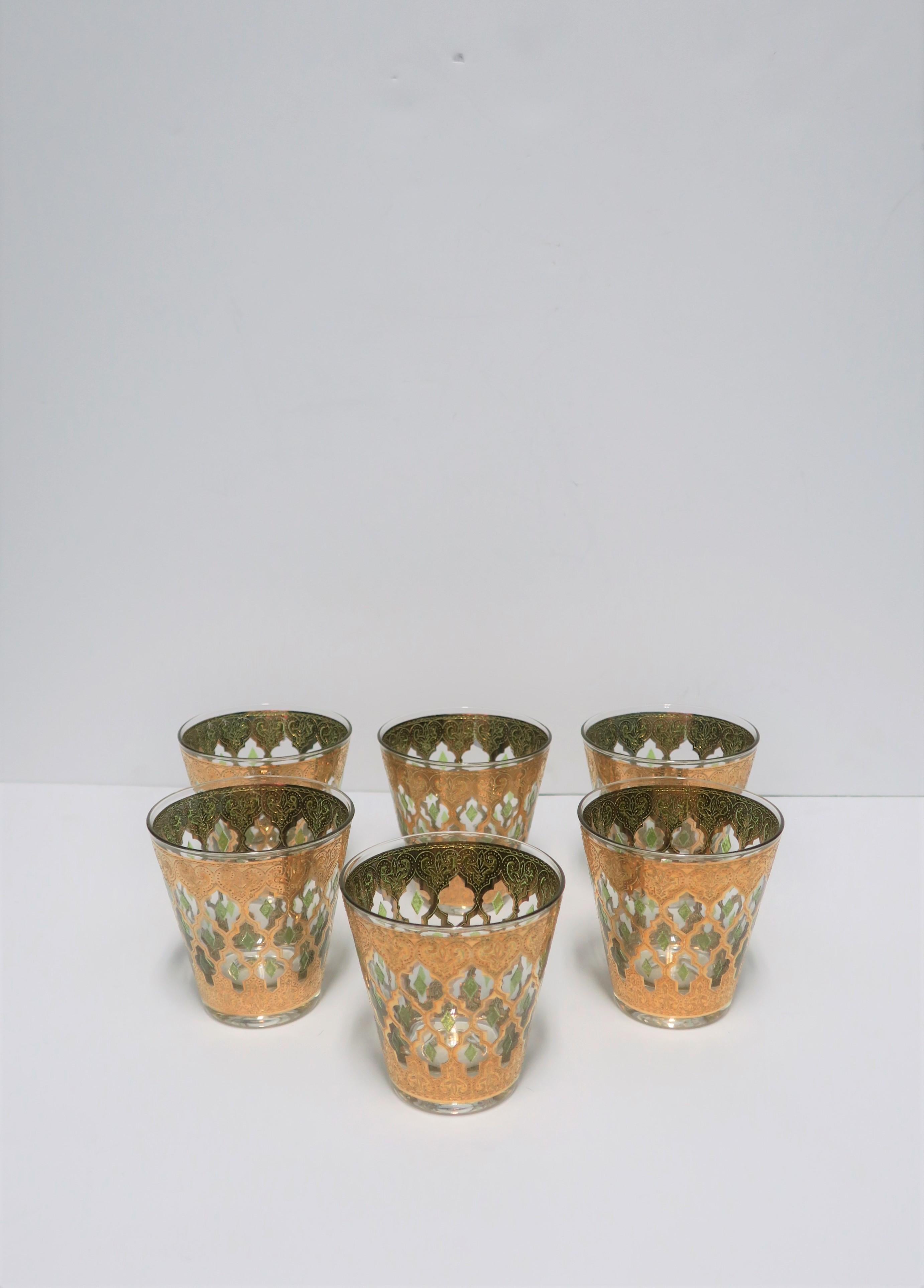 A beautiful set of 6 vintage Mid-20th century rocks' glasses with 22-karat gold and celadon green marque Moroccan or Moorish style design, circa 1960s, U.S. Great for entertaining, bar cart, or bar area. With maker's mark on each glass, please see
