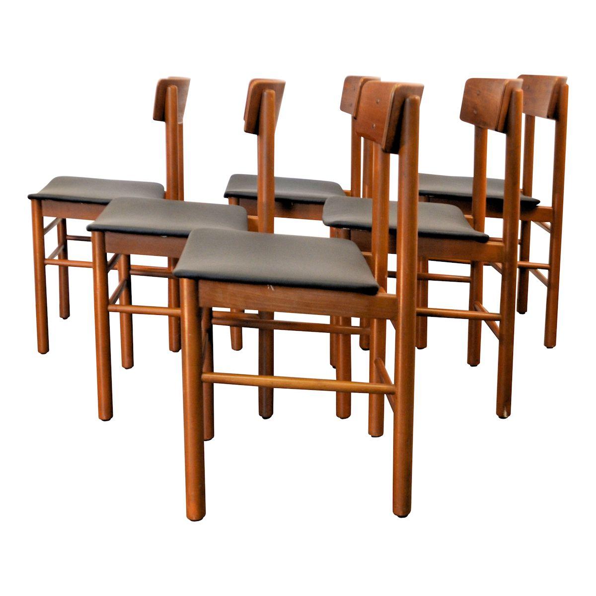 Set of 6 Mid-Century Modern Danish design teak/beech dining chairs produced by Farstrup during the 1960s. All chairs have a new black Skai leather upholstery.