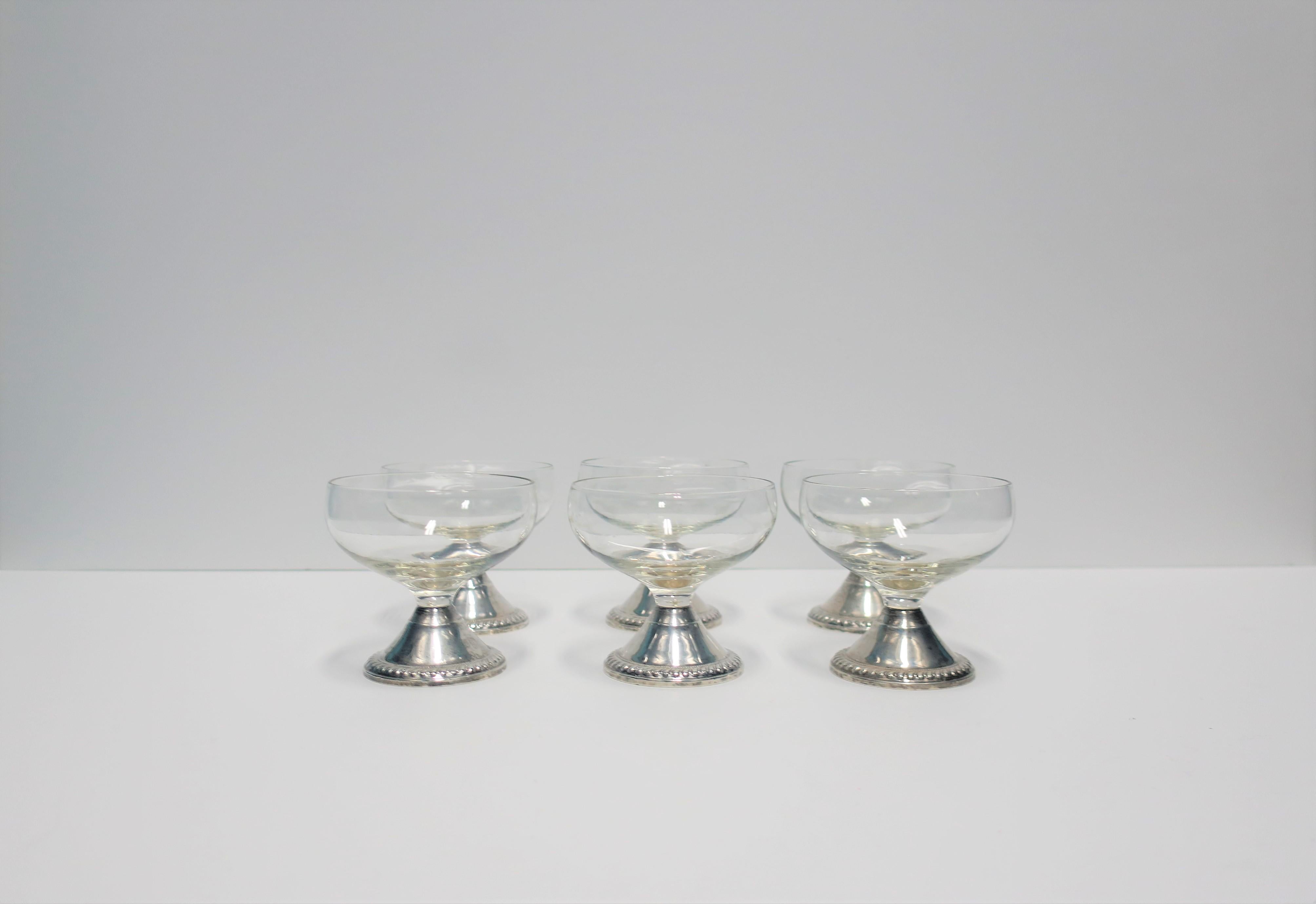 A beautiful set of 6 mid-20th century Champagne or cocktail glasses with sterling silver bases, by Duchin. Set could also be used to a cocktail or dessert. With maker's mark and sterling silver marking on bottom as show in image #4. Beautiful for