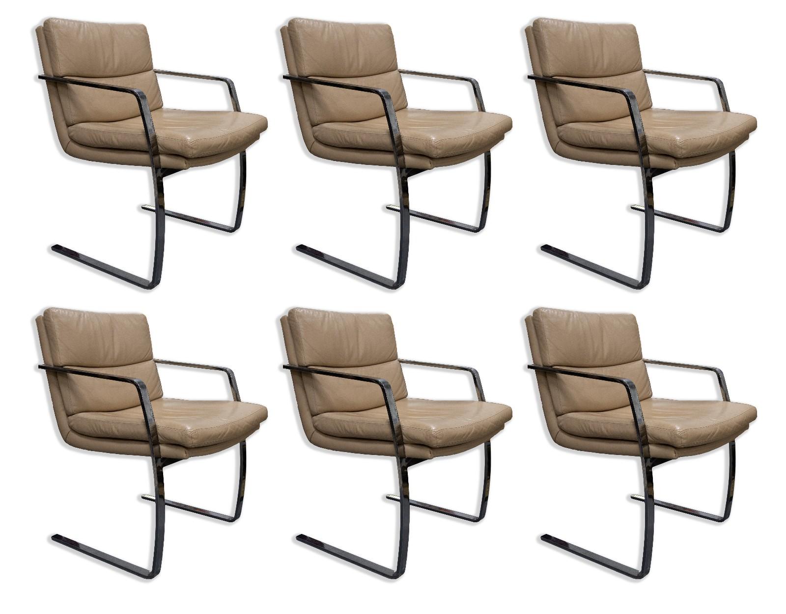 This set of six Milo Baughman Brown Leather and Chrome Cantilever Chairs is a true mid-century modern masterpiece. The combination of sumptuous brown leather upholstery and sleek chrome cantilever frames creates a striking visual contrast that