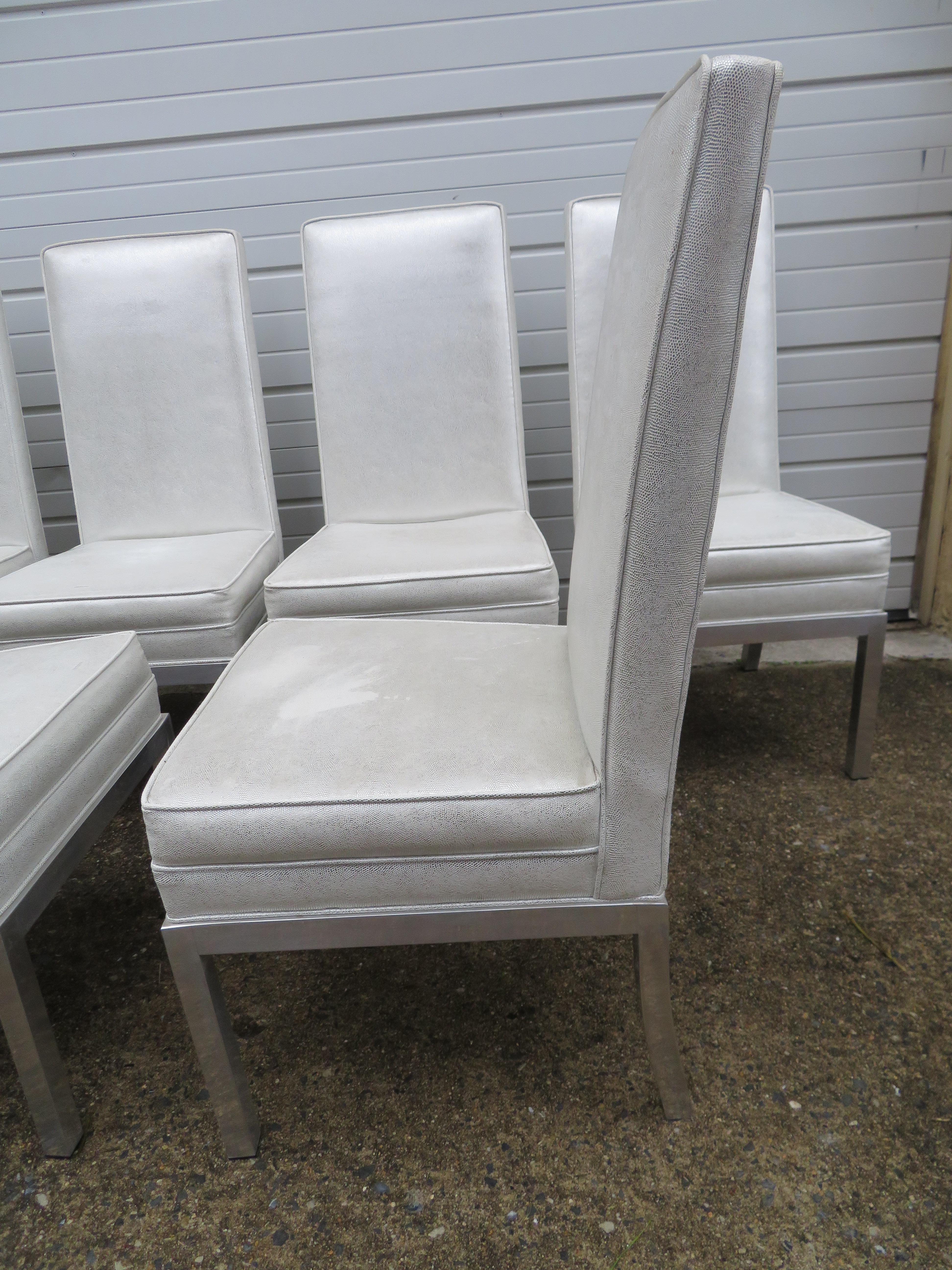 Stunning set of 6 Milo Baughman thick chunky aluminum dining chairs.  The aluminum frames have acquired a rich mellow patina to the aluminum.  They have been reupholstered in a vinyl silver snakeskin about 10 years ago and still look great-only