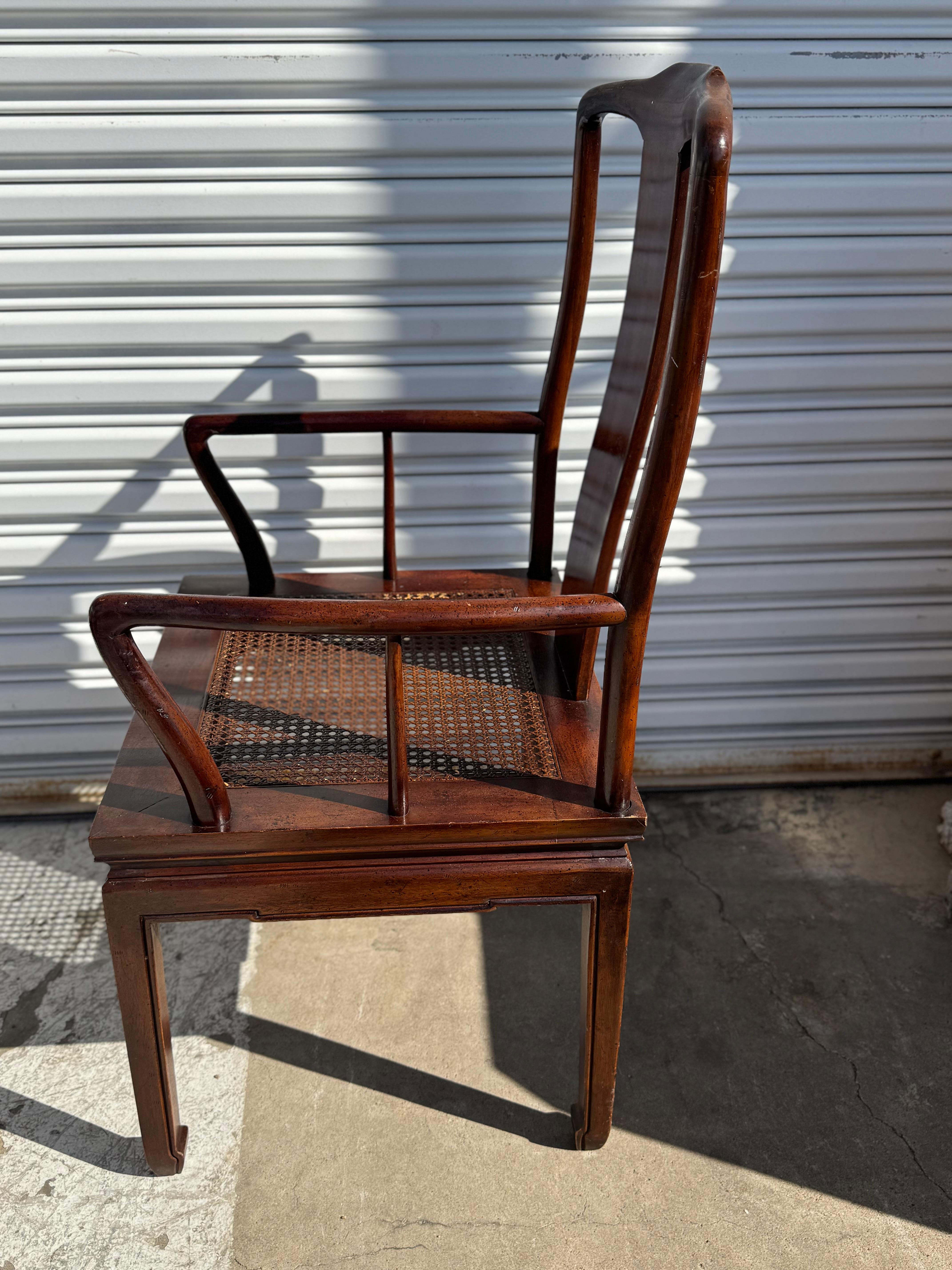 These chairs are made by Henredon Furniture..
They're made of walnut and have cane seats.
The chairs also have custom made upholstered seat cushions.
The arms are pleasantly sculpted.

The set contains 2 armchairs and 4 sides.