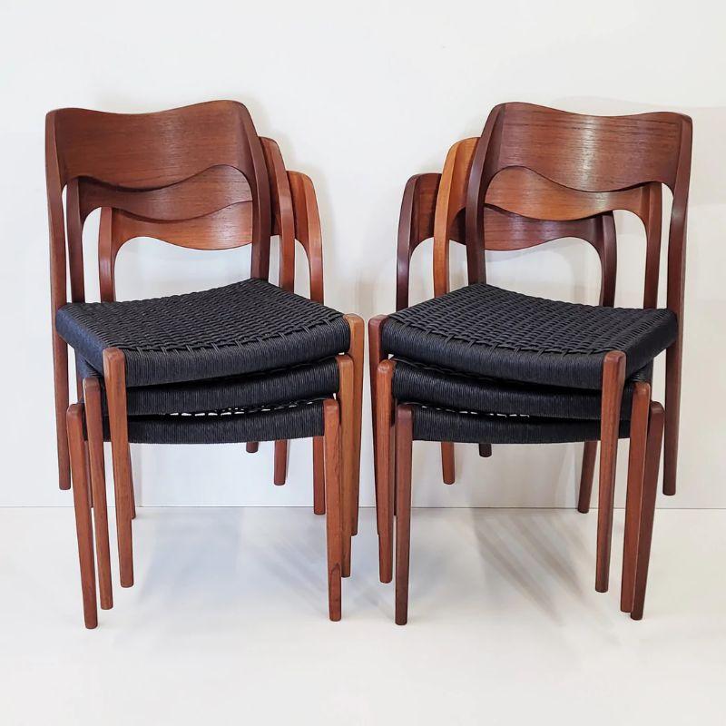 Set of 5 teak dining chairs designed by Niels O. Moller for his own company J.L. Moller Mobelfabrik, Denmark.

The Model 71 circa 1950's was one of Moller’s first designs and remains an all time Danish classic. The chairs have newly woven paper cord