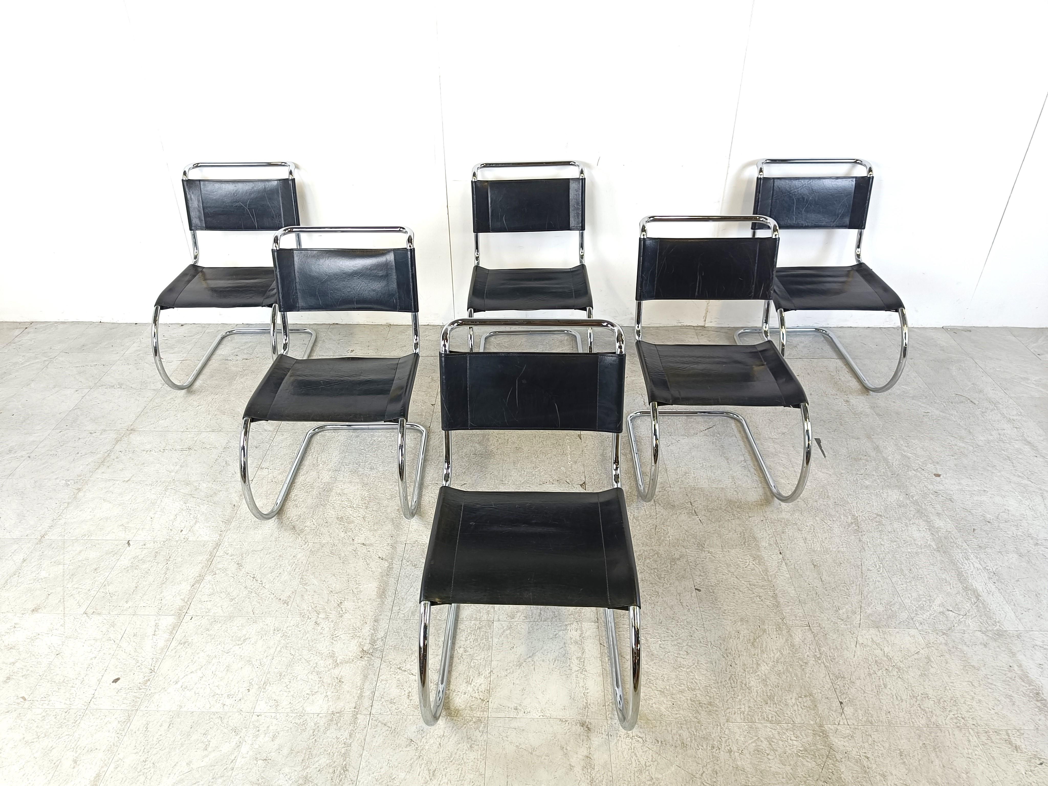 Vintage  cantilever dining chairs designed by Ludwig Mies van der Rohe and produced by Thonet.

Beautiful elegant Bauhaus design dating from the 1920s with a chromed metal tubular frame and thick quality black sling leather seats and