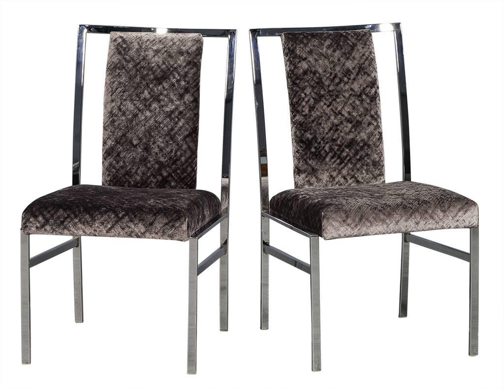 These modern chrome dining chairs come in a set of six with four regular and two captain’s chairs. Each is composed of a chrome frame with soft plush fabric on the seat and backrest. A gorgeous set perfect for a luxurious home.