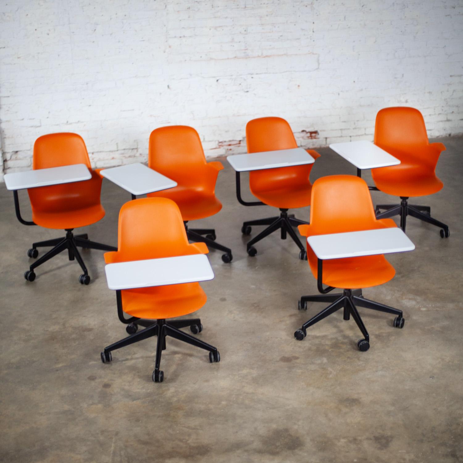 Wonderful Early 21st Century Modern Steelcase orange Node Task Chairs with a white work surface, black metal shaft, & black 5 prong base with casters, set of 6. Beautiful condition, keeping in mind that these are vintage and not new so will have