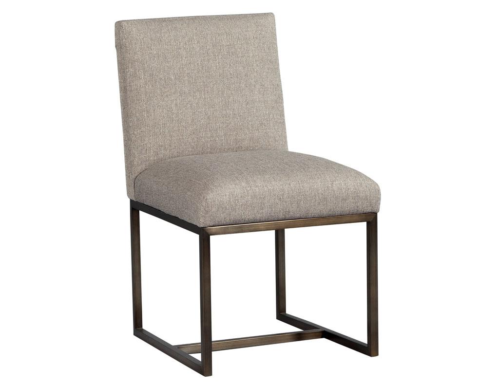 Demanding immediate attention, this fabulously designed modern chair is sure to add glam to any room. Upholstered in a sumptuous linen, with a pleated accent on the back, perched on a bronze colored stainless-steel base providing a solid foundation
