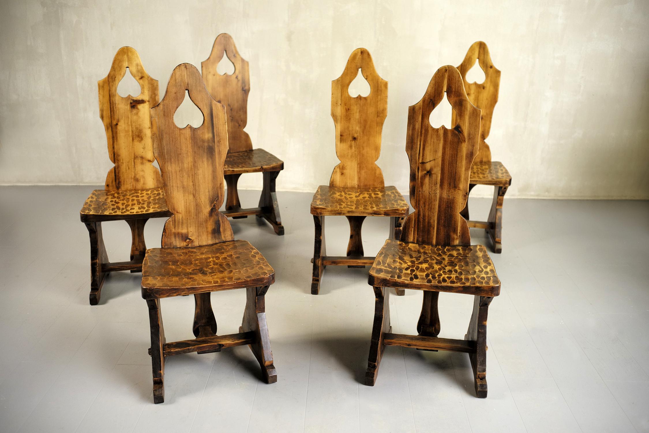 Set of 6 fir chairs, France 1950. The backrest is decorated with an upside-down heart (according to historians, this symbol was used by Protestants during the French religious wars). The seat is worked with a gouge, the base is lined with a beech