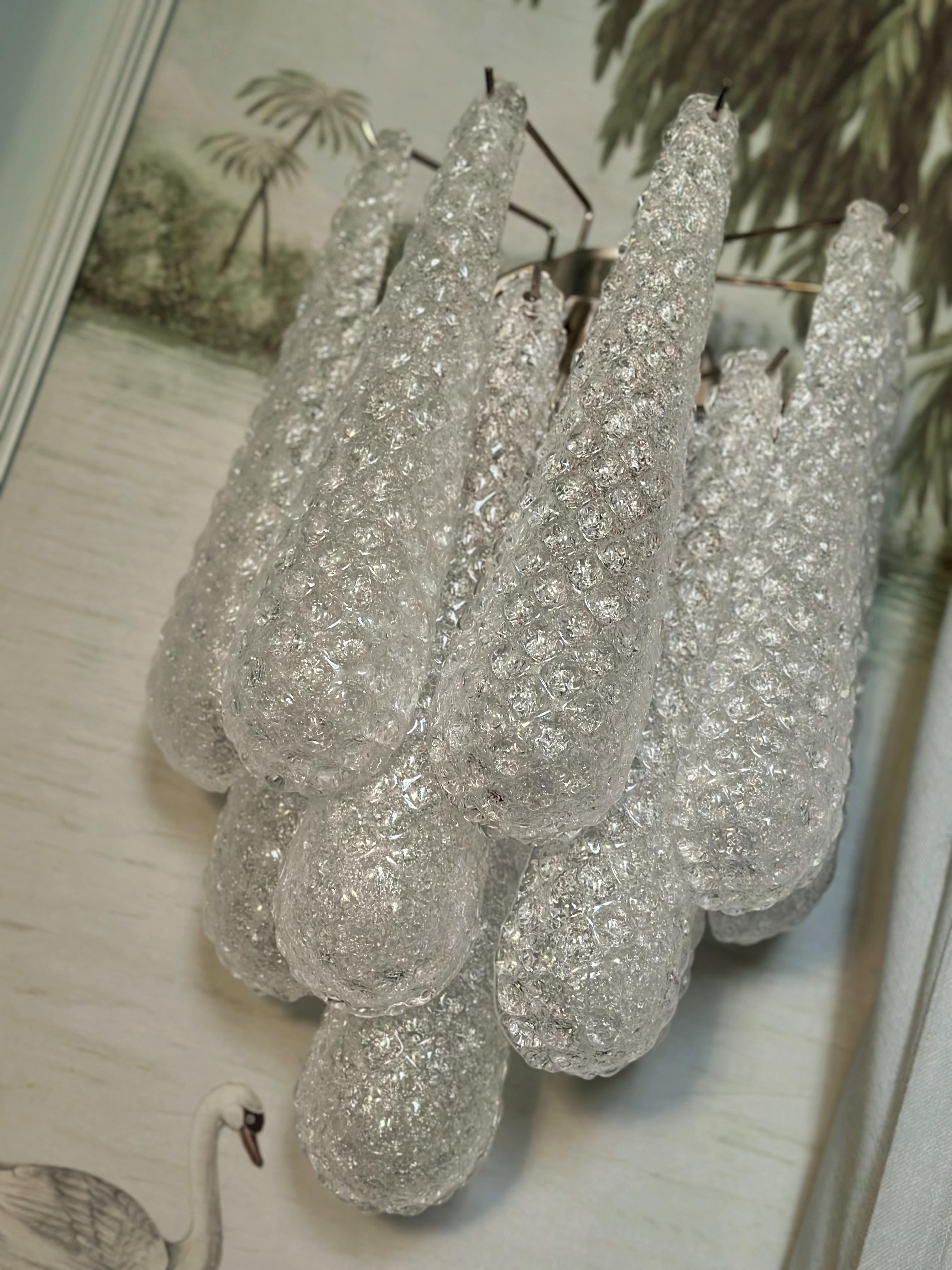 Set of 6 six Murano Wall Sconces consisting of ten glass drops fixed on a chrome frame. Traditional Italian Mid-Century Style.
Size of the drop glass prism: 32 x 8 cm (12.6 ”x 3.1”)

Two E14 bulbs.

Measure:
Height: 45 cm / 17.7”
Width: 34 cm /