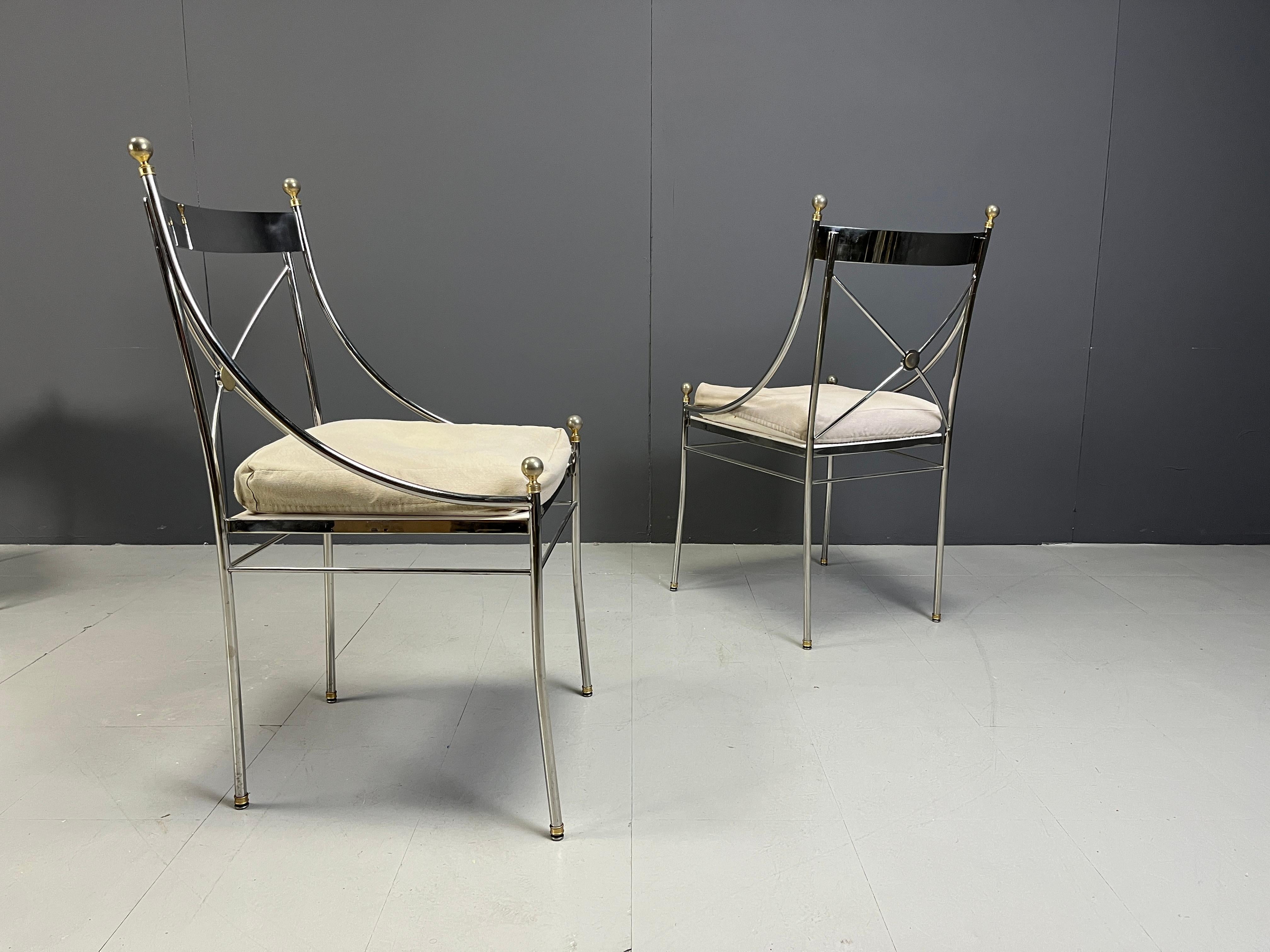 Set of 6 rare neoclassical design dining chairs by Belgochrom with chromed metal frames, brass finials and fabric cushions.

Beautiful classical design, timeless

Good condition

1970s - Belgium

Dimensions:
Height: 95cm
Width: 47cm
Depth: 55cm
Seay