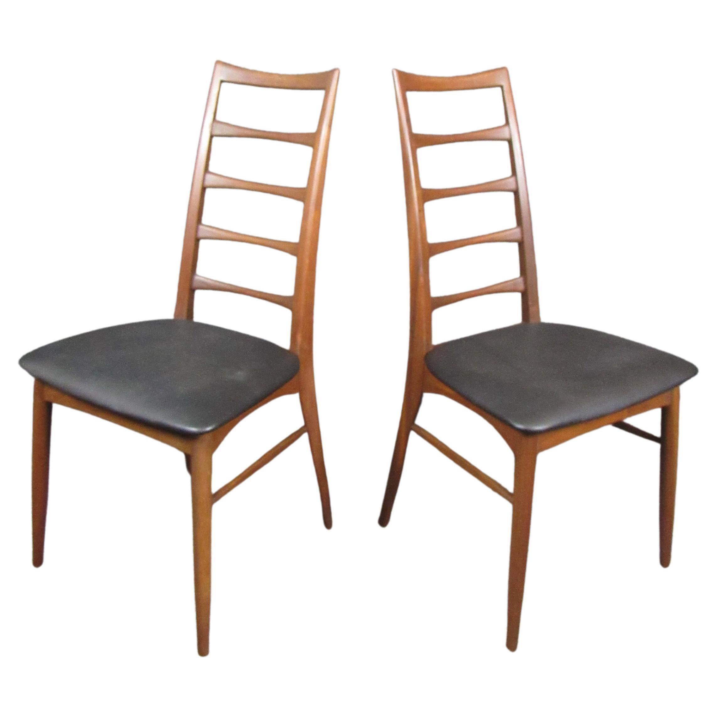 Pair of 6 Niels Kofoed Dining Chairs. Teak wood ladder back chairs with matte black leather cushion. These Kofoed style chairs are unmatched when it comes to Danish mid century. The set would pair beautifully with a teak dining table.
Please