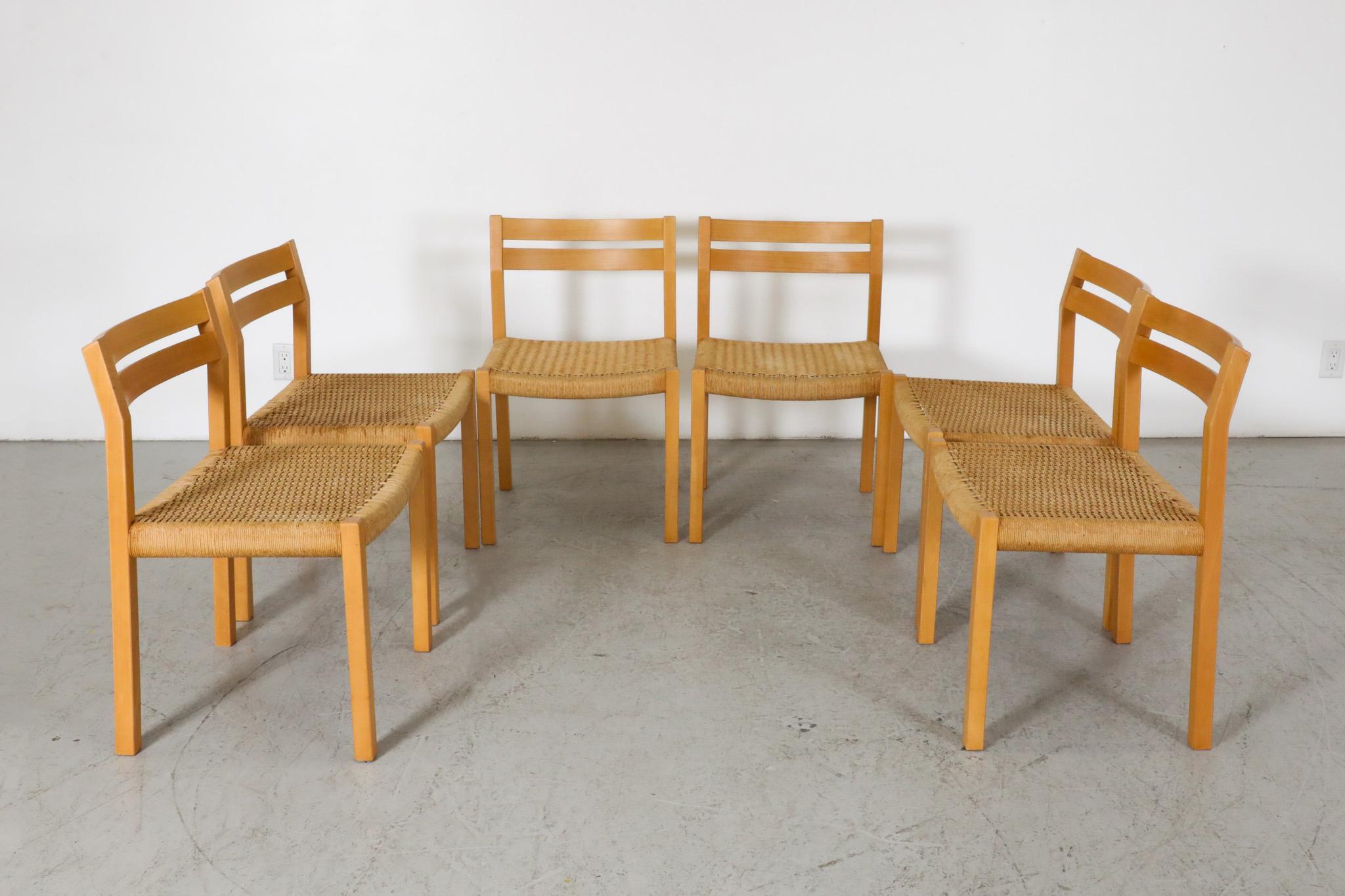Lovely set of 6 light oak, Mid-Century, dining chairs with woven papercord seats by Neils O. Möller for  J.L. Møllers Møbelfabrik. Niels Otto Møller's designs for are highly regarded and widely considered to high points in 20th century Danish