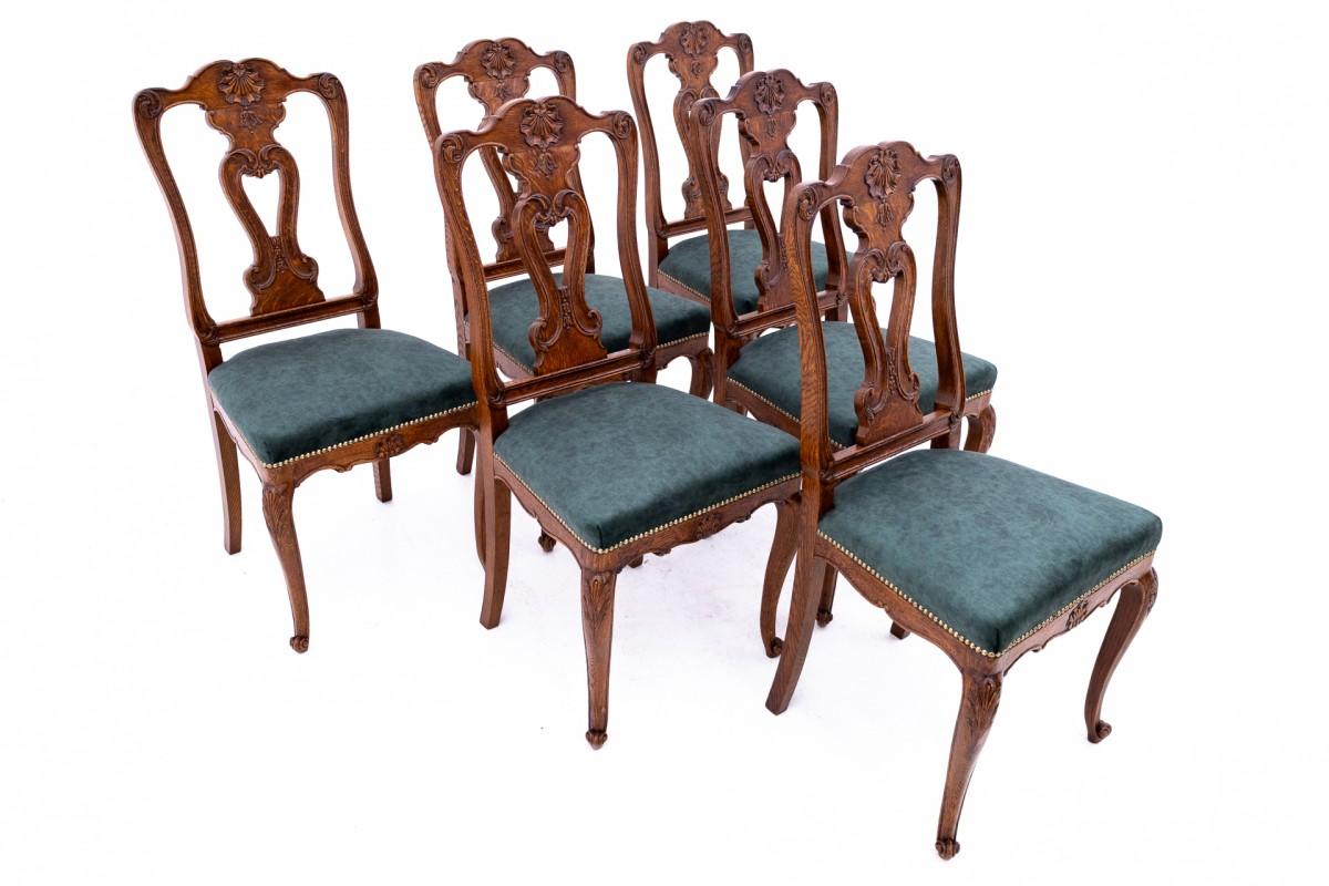 Set of 6 oak chairs, Western Europe. The solid oak chairs are upholstered in new dark green fabric and finished with decorative copper upholstery nails.

Chairs: height 102cm; width 48cm; depth 51cm; seat height 48cm.