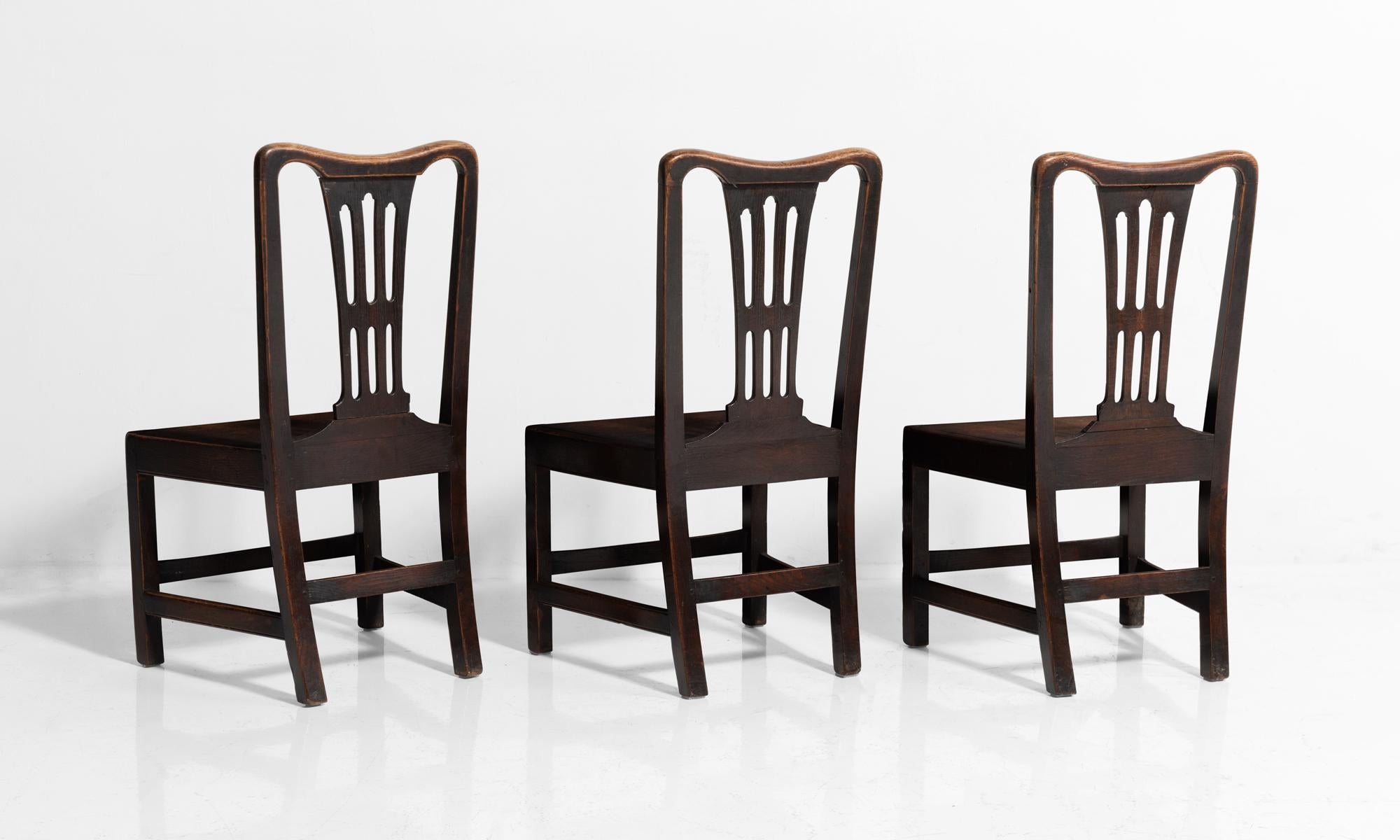 Solid oak chairs with single piece inset oak seats.