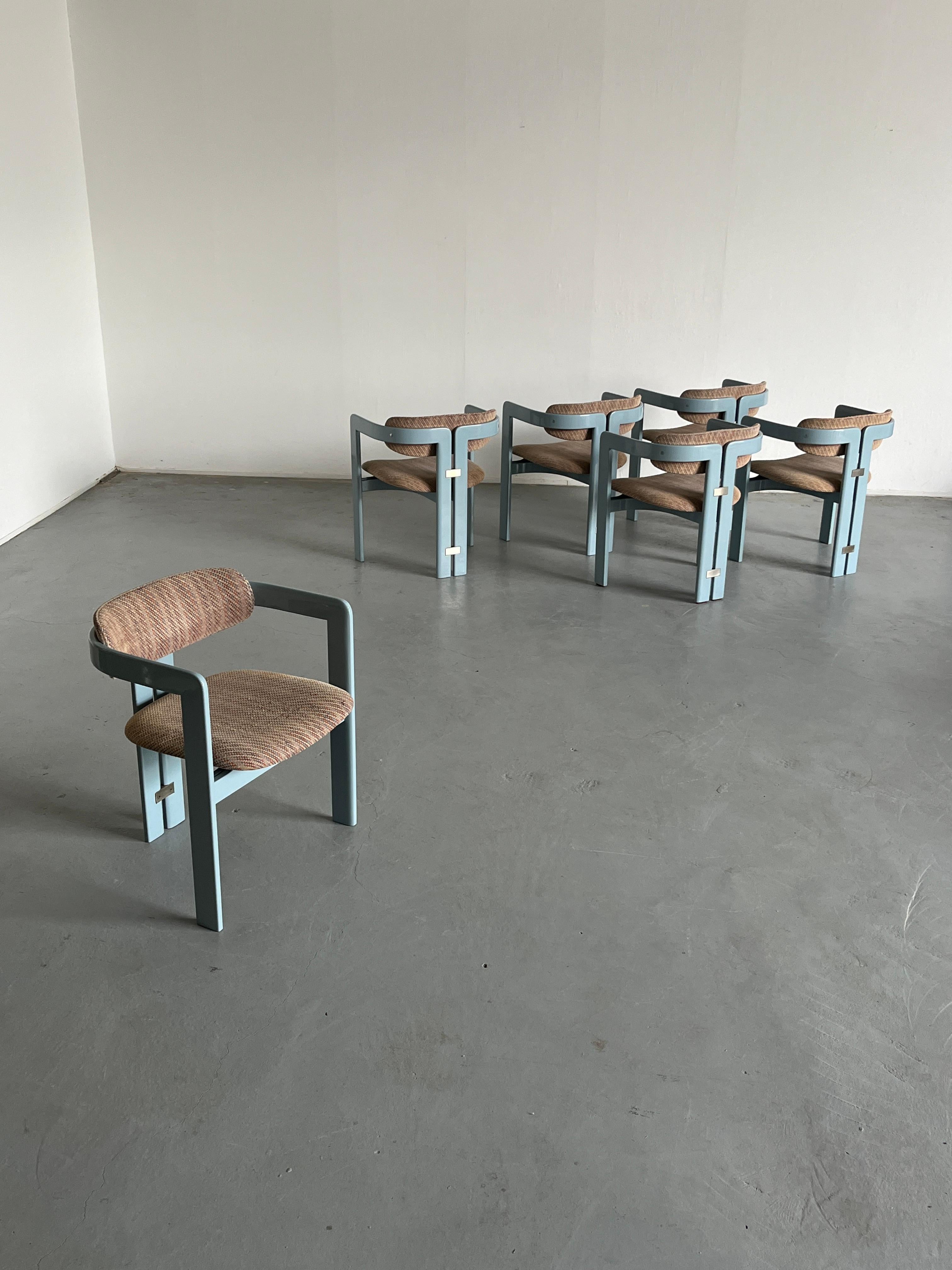 An absolute Mid-Century design classic - the original Pamplona chairs designed by the Italian architect and designer Augusto Savini for Pozzi.
In an original and rare Memphis colour combination - a light blue lacquered wooden frame, and a