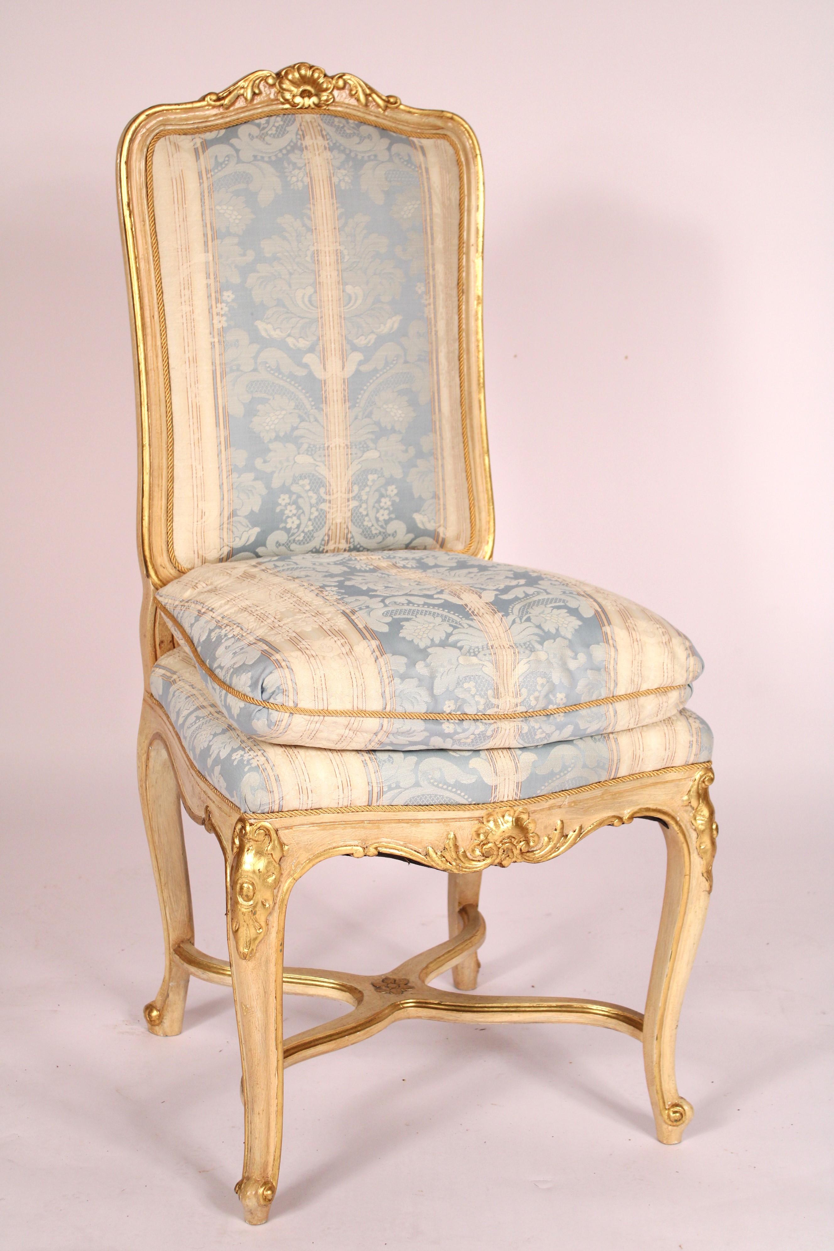 Set of 6 Louis XV style painted and gilt (Gold Leaf) decorated dining room chairs, circa 1980's. With cupid's bow painted and gilt decorated crest rails with central shell carving, painted and gilt decorated stiles, removeable seat cushions, apron