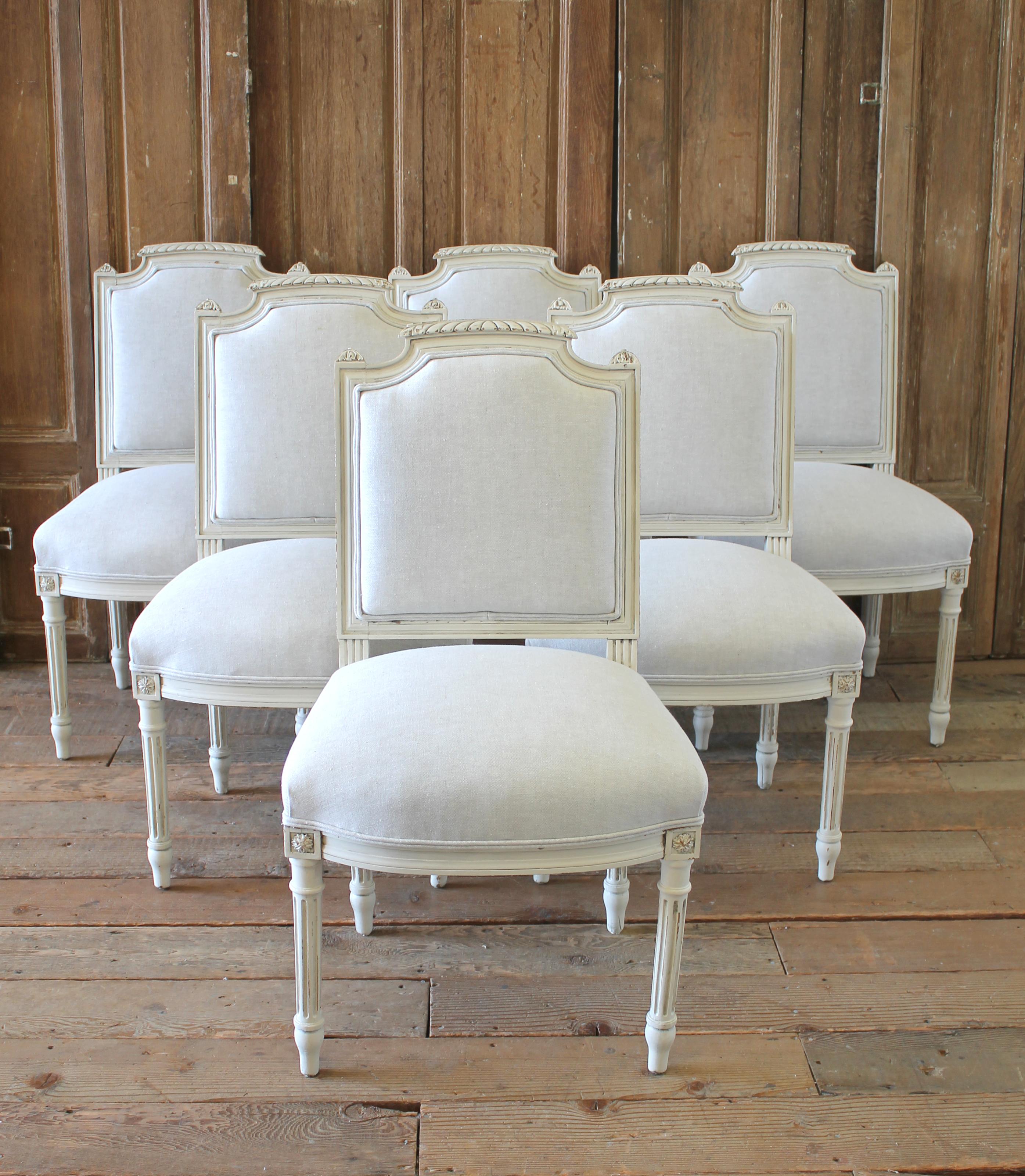 Set of 6 painted and upholstered Louis XVI style dining room chairs.
Painted in our soft oyster white, with subtle distressed edges, and finished with an antique glazed patina. This off white color blends beautifully with all shades of white. The